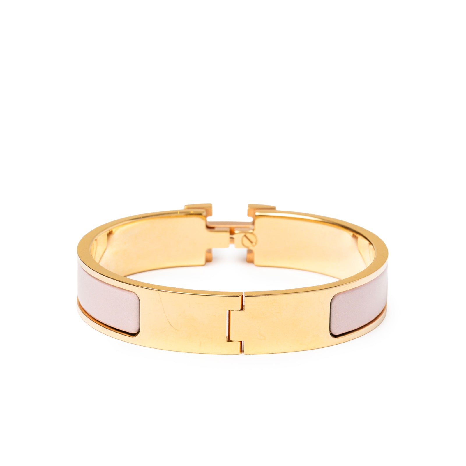 Back close-up of Hermès Clic H bracelet PM Pink Gold Hardware showing polished gold and soft pink enamel panels