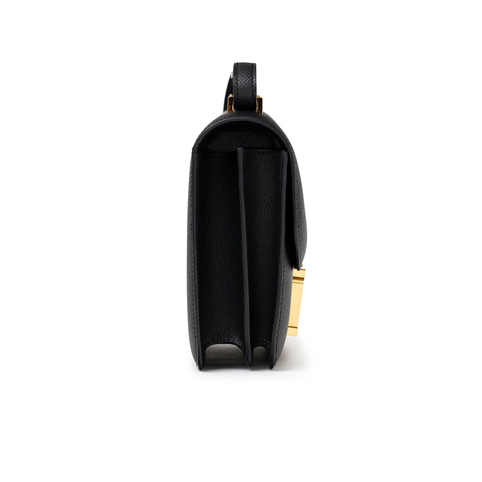 Side view of Hermès Constance 18 Black Epsom Gold Hardware showing structured compartments and leather texture.