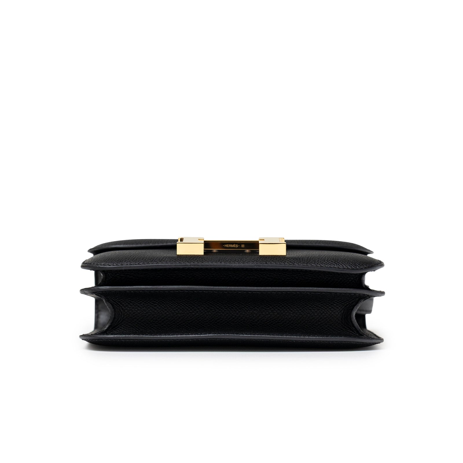 Bottom view of Hermès Constance 18 Black Epsom Gold Hardware showing structured compartments and gold clasp details