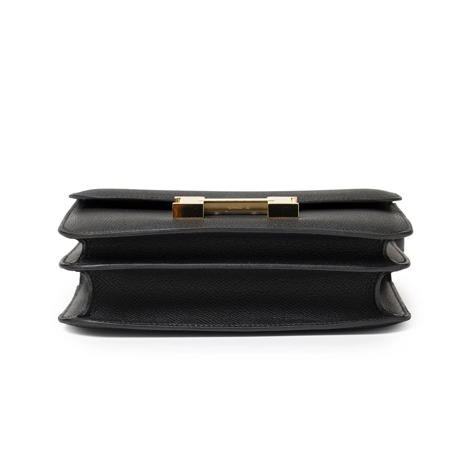 Bottom view of Hermès Mini Constance 18 Black Epsom Gold Hardware showing leather texture and three compartments