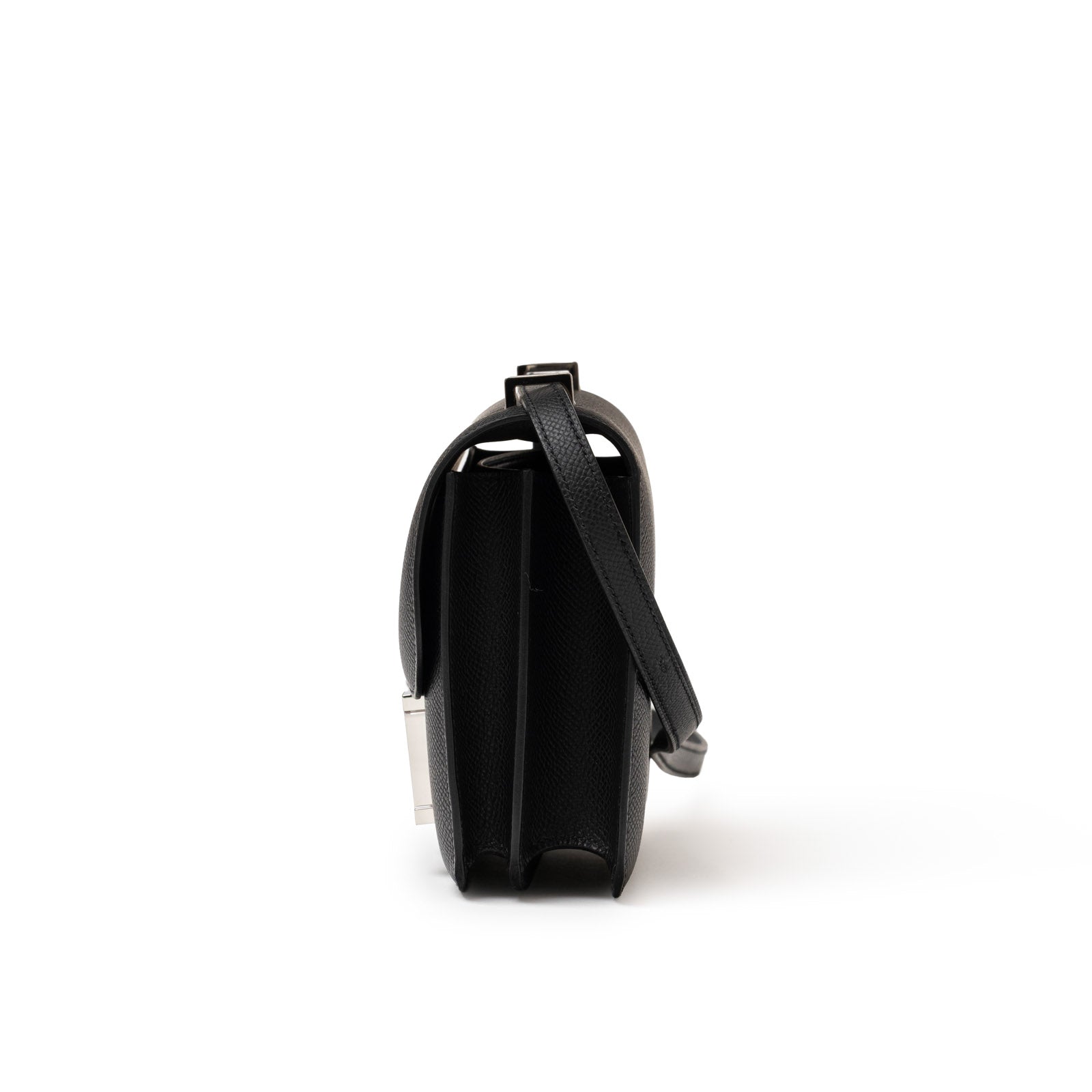 Side view of Hermès Constance 18 Black Epsom Palladium Hardware showcasing slim profile and leather strap detail