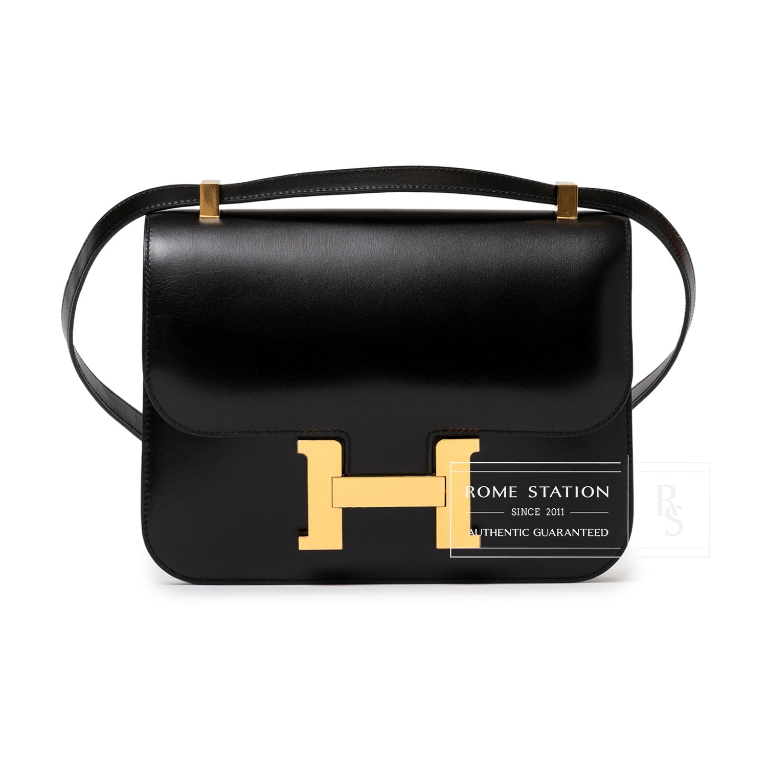 Front view of Hermès Constance 24 Black Box Gold Hardware showing smooth leather and signature gold clasp detail