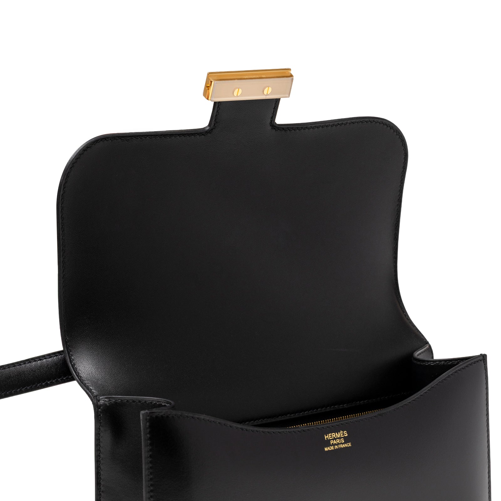 Interior view of Hermès Constance 24 Black Box Gold Hardware showing smooth leather and gold clasp inside flap