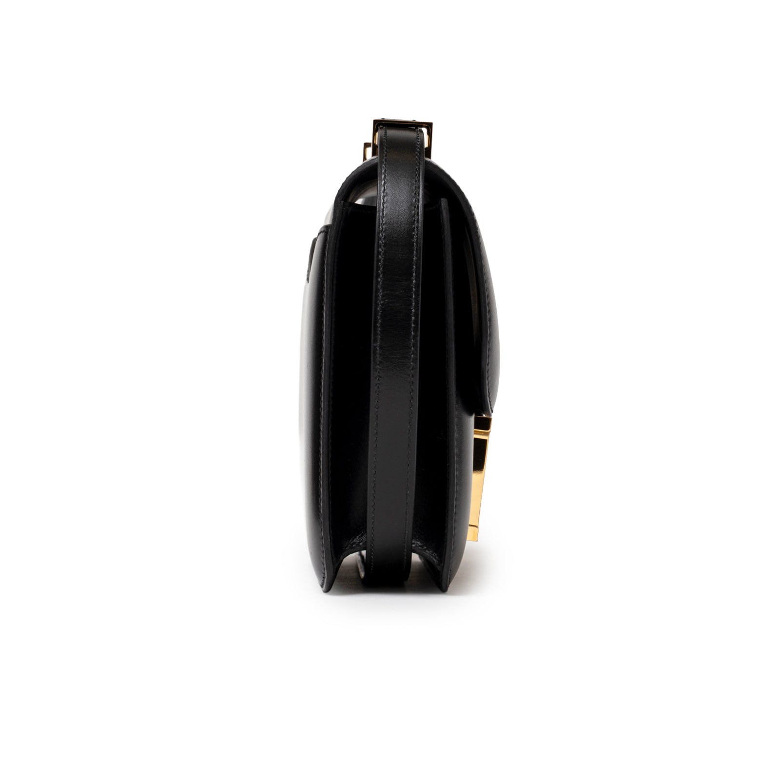 Side profile of Hermès Constance 24 Black Box Gold Hardware showing smooth black leather and gold clasp detail