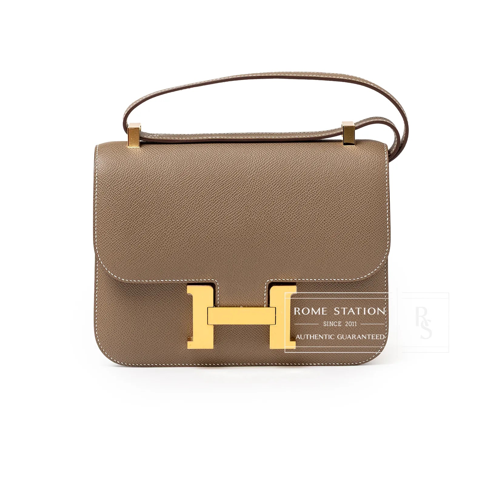 Front view of Hermès Constance 24 Etoupe Epsom Gold Hardware with structured leather and signature clasp