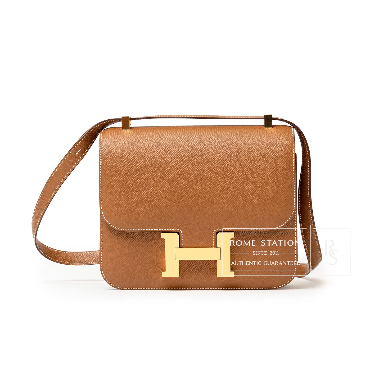 Front view of Hermès Constance 24 Gold Epsom Gold Hardware handbag in tan leather with gold clasp detail
