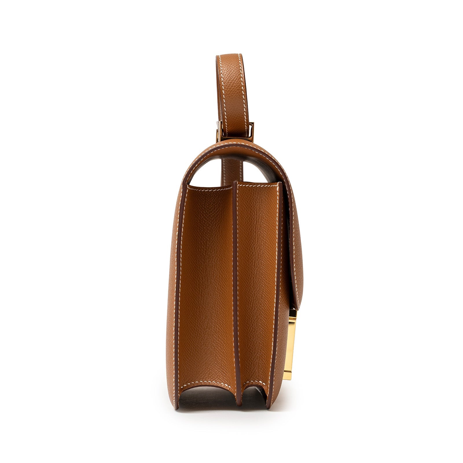 Side profile of Hermès Constance 24 Gold Epsom Gold Hardware showing leather texture and structured compartments