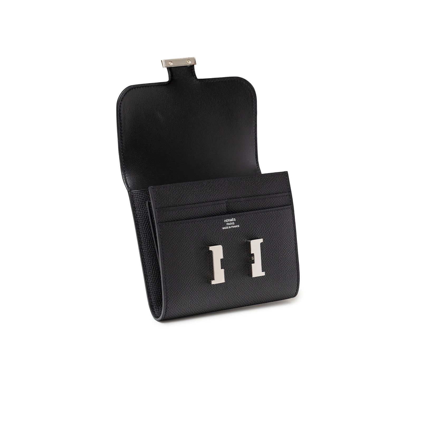 Open angled view of Hermès Constance Compact Wallet Black Epsom Palladium Hardware showing card slots and clasp interior