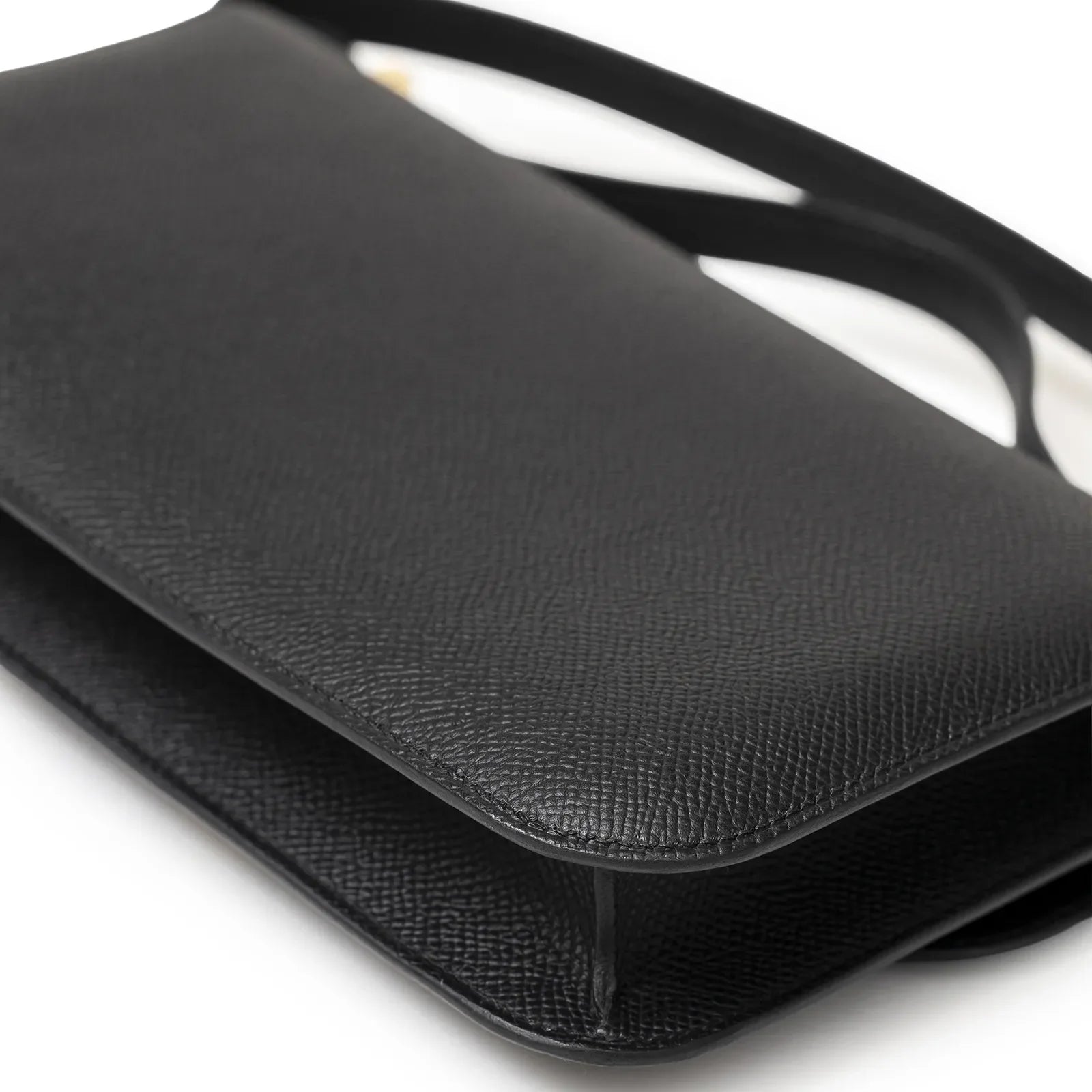 Close-up angled view of Hermès Constance Elan Black Epsom Gold Hardware showing texture and flap details