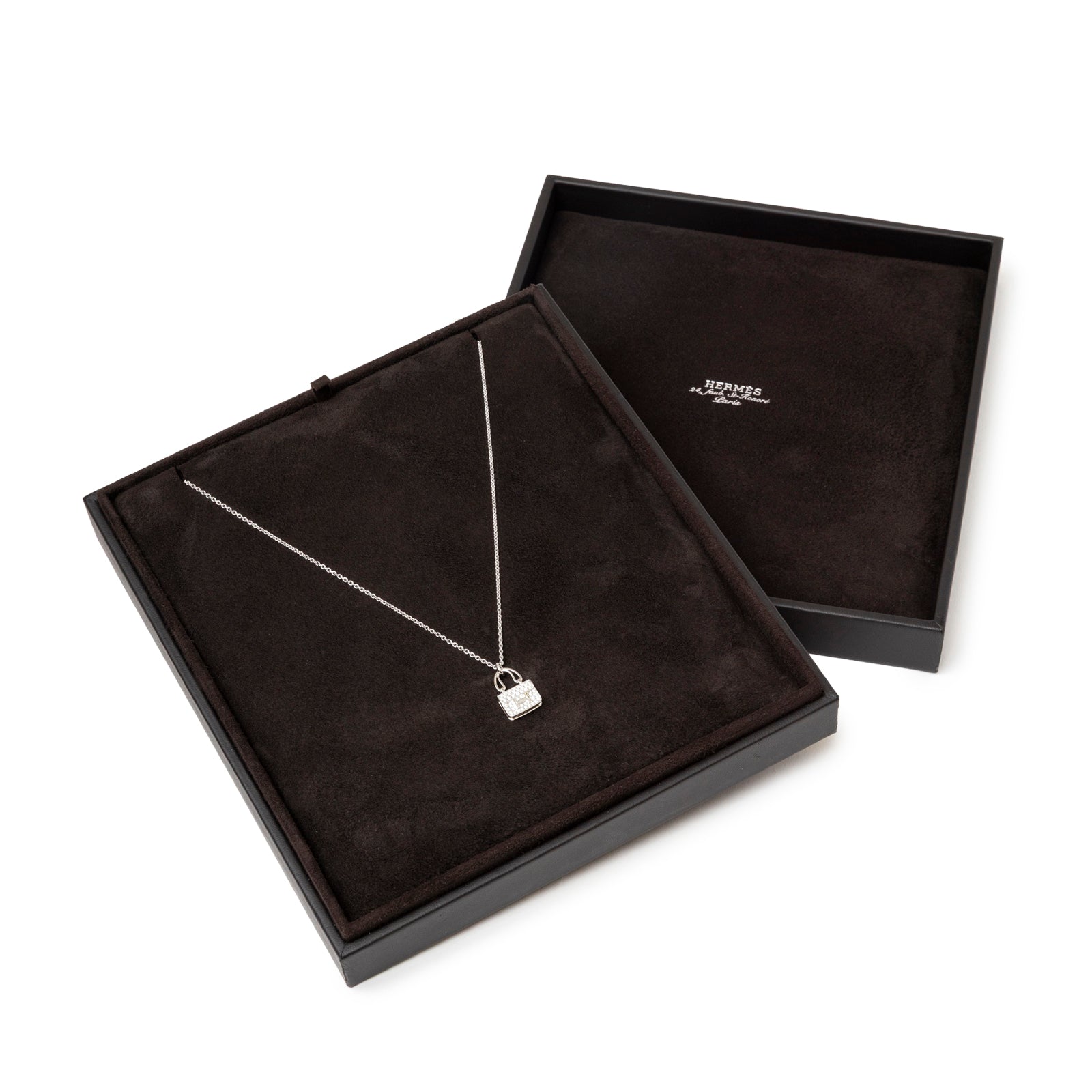 Hermès Constance Pendant 18K White Gold and Diamonds displayed in a Hermès original box.