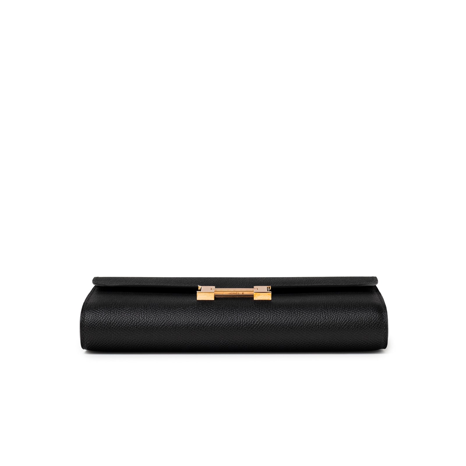 Bottom view of Hermès Constance To Go Wallet Black Epsom Rose Gold Hardware showing folded leather edge and clasp detail