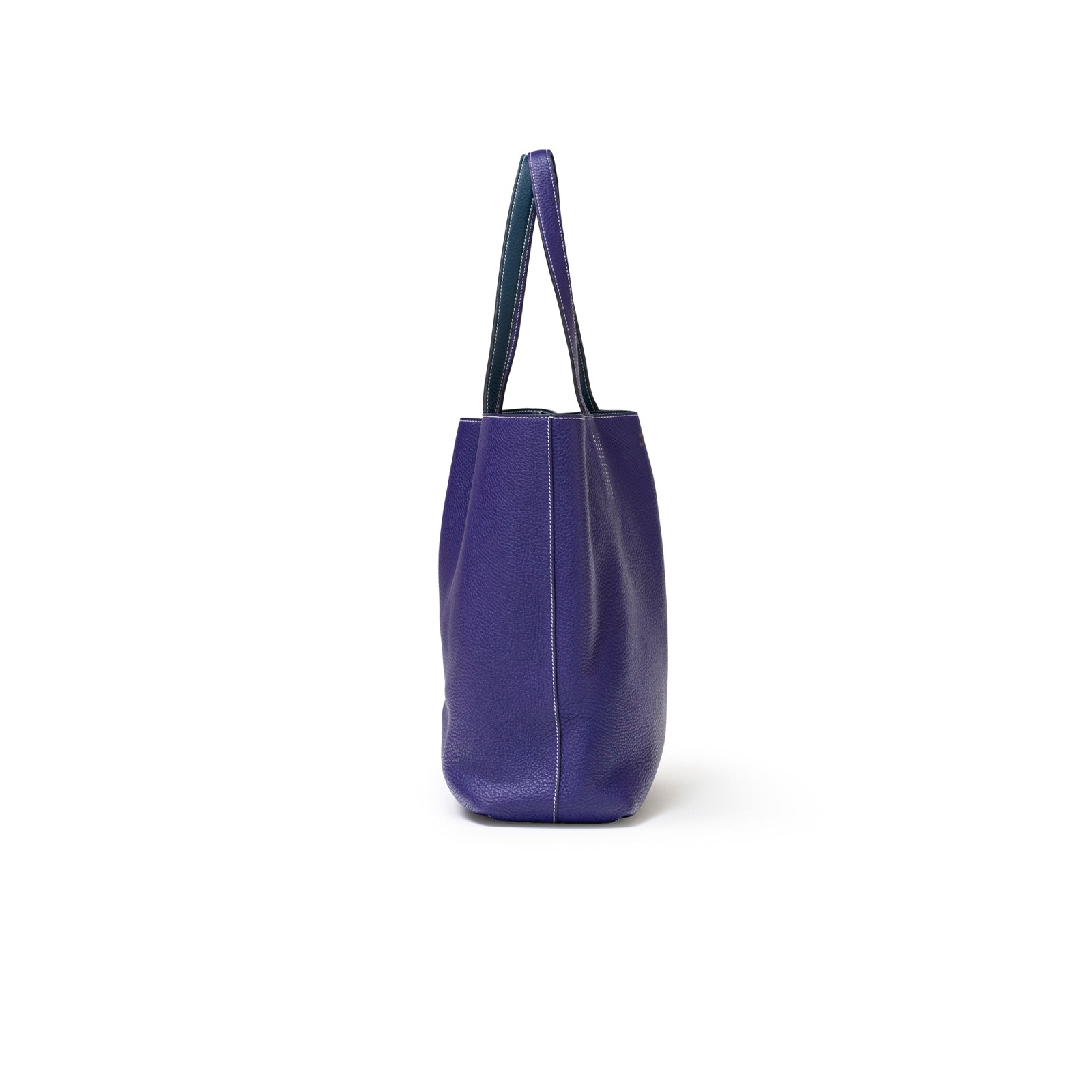 Side view of Hermès Double Sens Reversible Bicolor Shoulder Bag Clemence Violet/Blue showing bag depth and strap detail