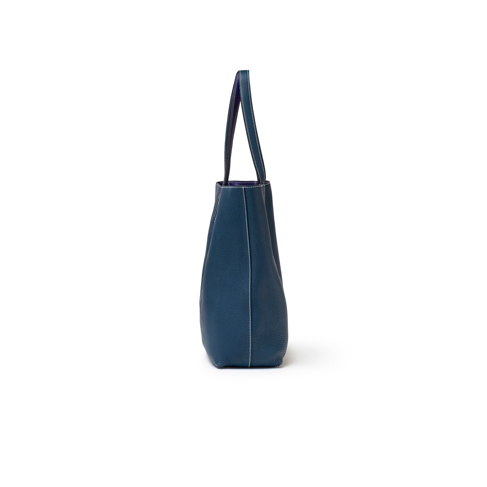 Side profile of Hermès Double Sens Reversible Bicolor Shoulder Bag Clemence Violet/Blue with violet strap edge visible