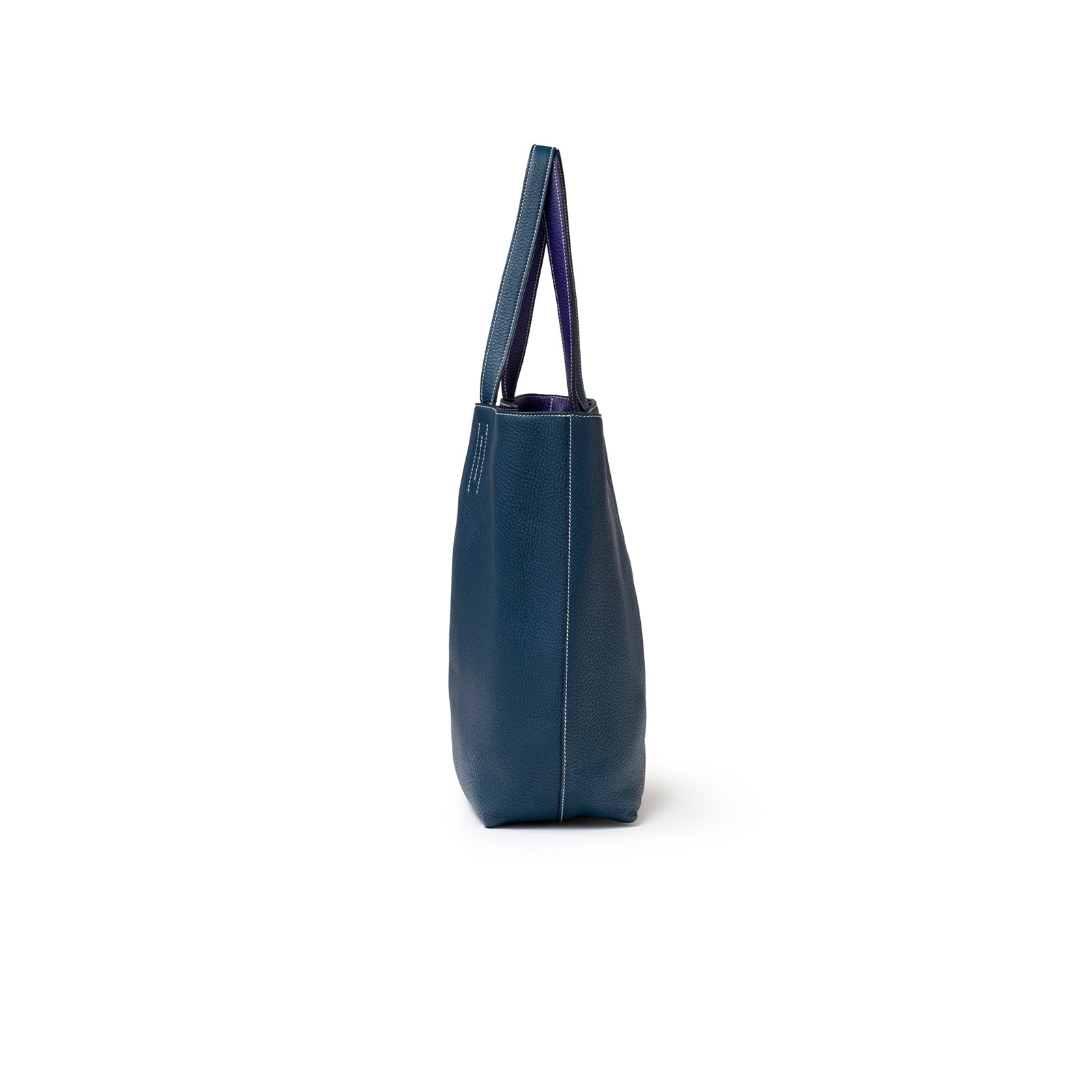 Side view of Hermès Double Sens Reversible Bicolor Shoulder Bag Clemence Violet/Blue showing sleek profile and strap details