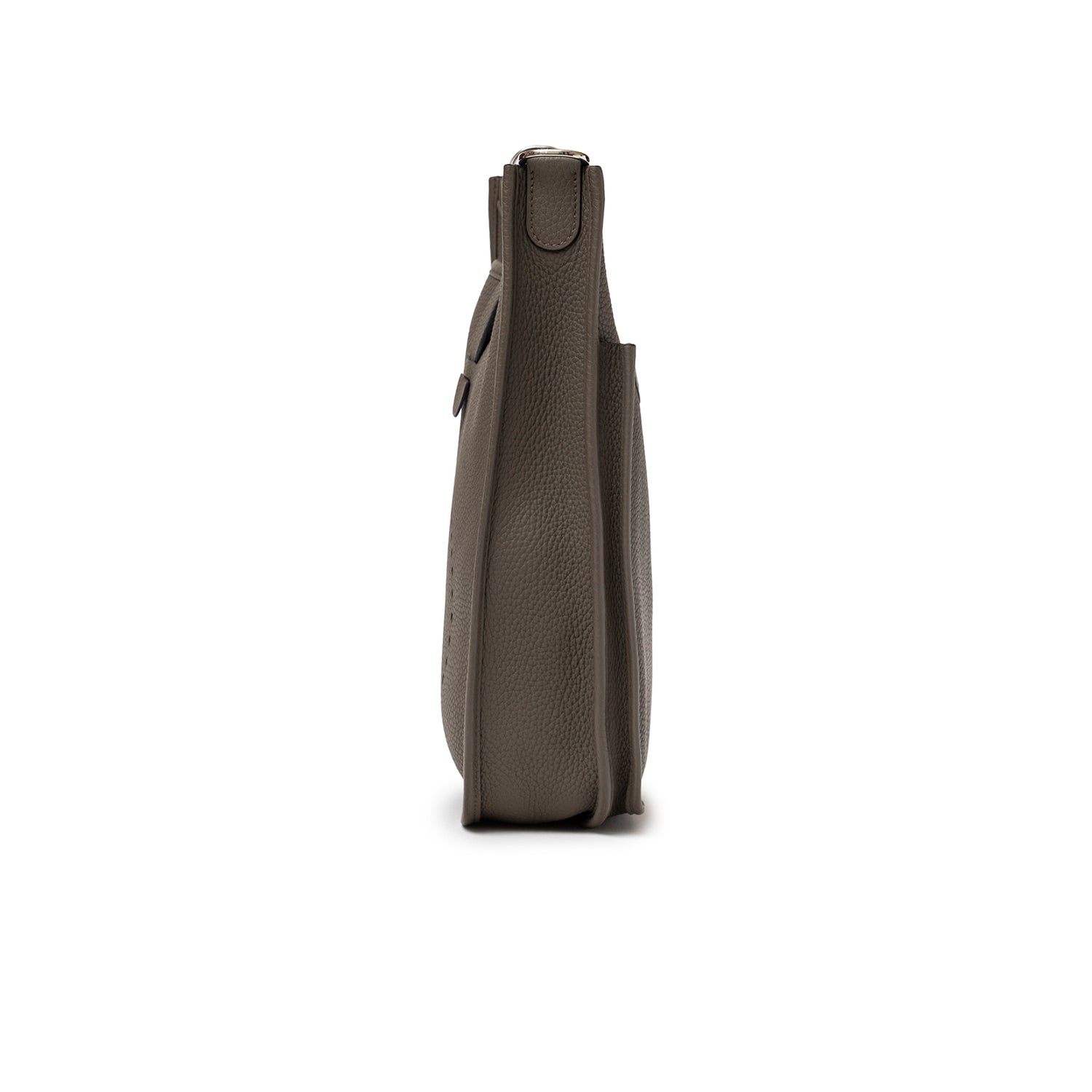 Side profile of Hermès Evelyne PM 29 Etain Clemence Palladium Hardware showing slim leather silhouette and texture detail