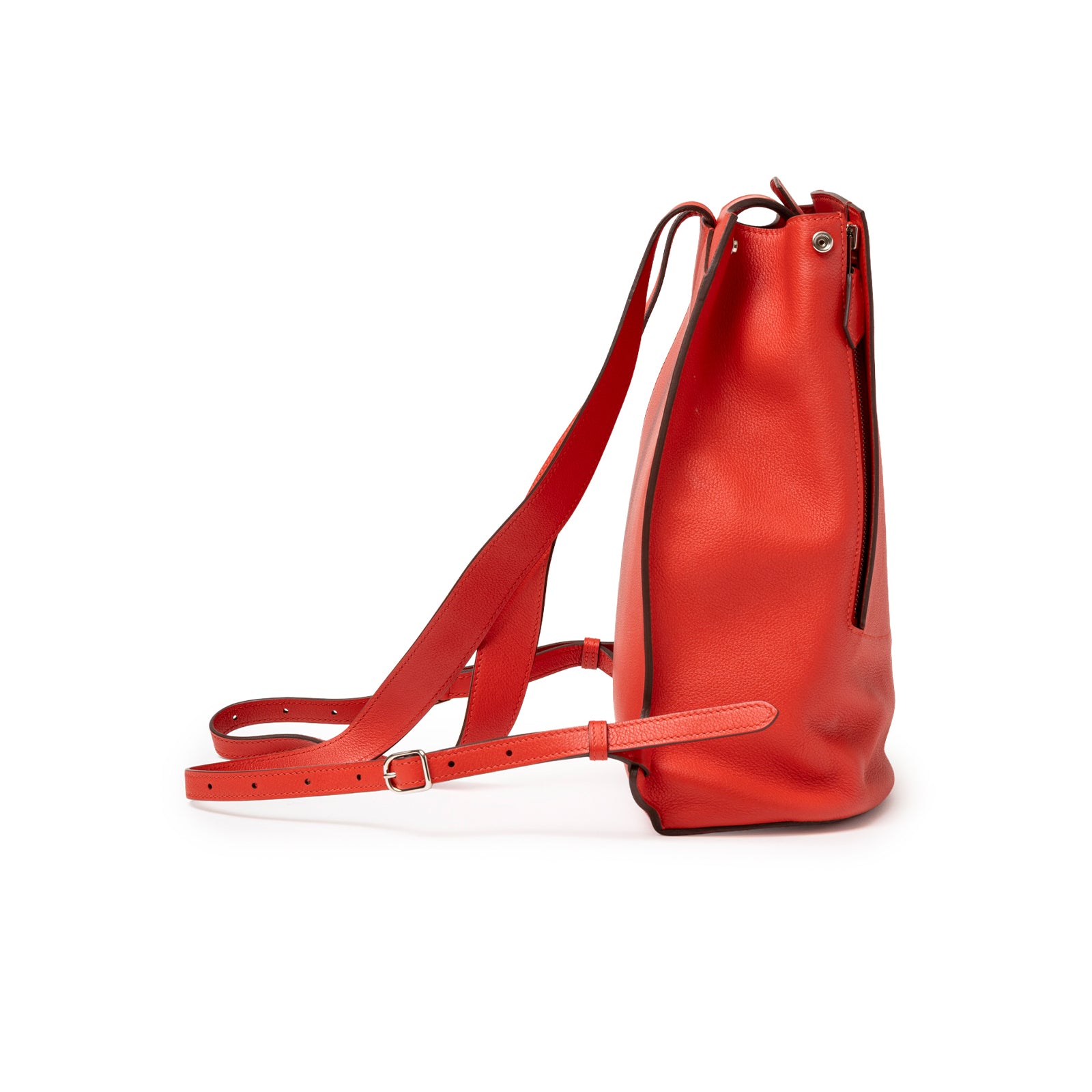 Side profile of Hermès Gr24 Backpack Rouge Tomate Evercolor Palladium Hardware highlighting smooth red leather and strap details