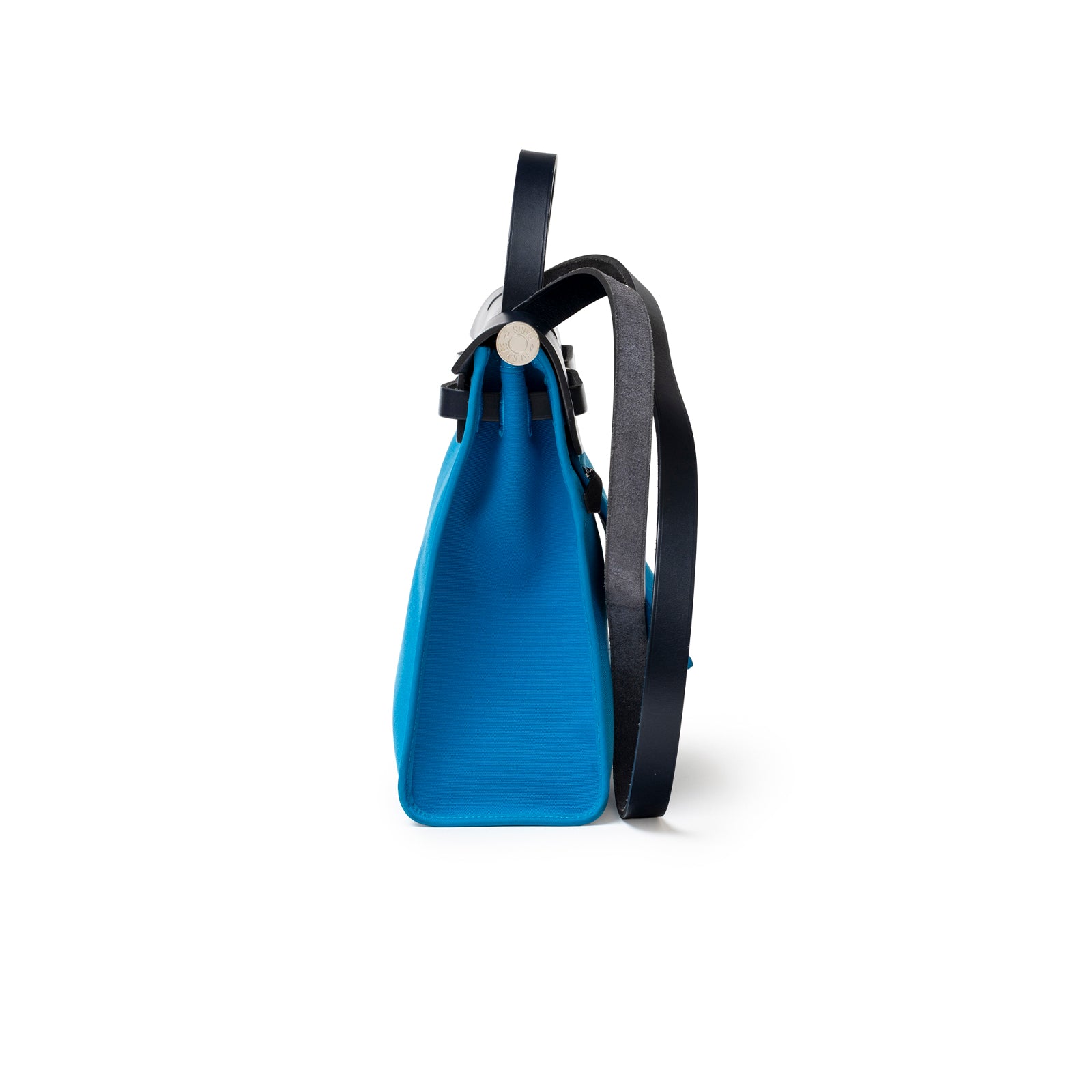 Side profile of Hermès Herbag Zip PM 31 Blue Vache Hunter Palladium Hardware with black strap showing bag depth