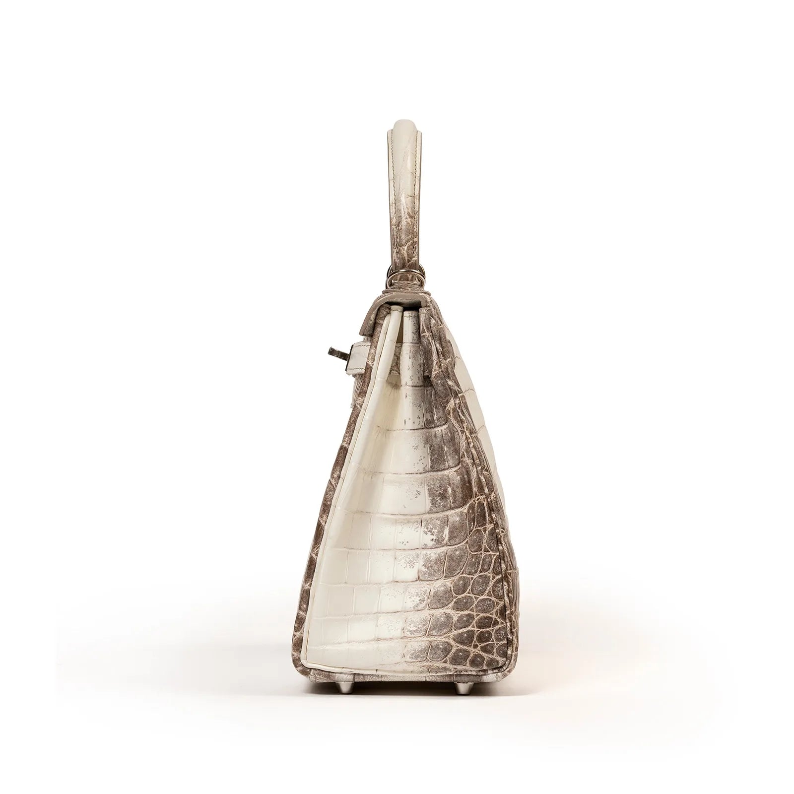 Side view of Hermès Himalaya Kelly 28 Retourne Blanc Matte Niloticus Crocodile Palladium Hardware handbag with structured silhouette on white background.