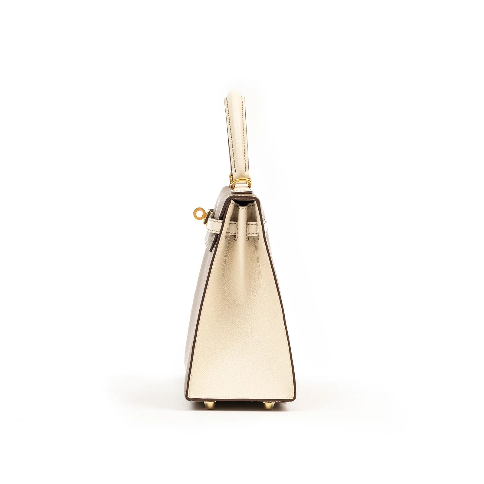Side view of Hermès Horseshoe Kelly 25 Sellier Etoupe/Craie Epsom Brushed Gold Hardware bag showing leather texture and handle details