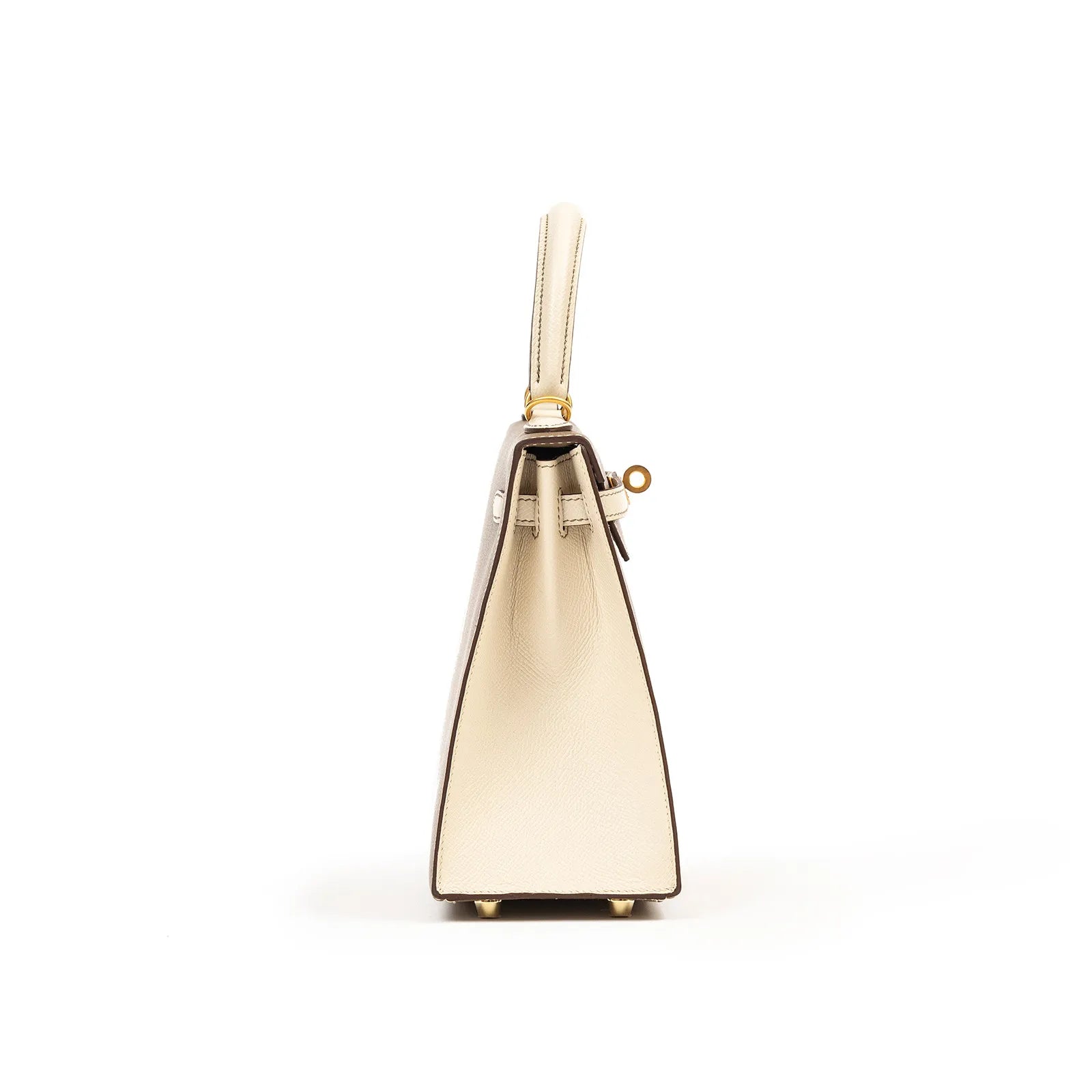 Side view of Hermès Horseshoe Kelly 25 Sellier Etoupe/Craie Epsom Brushed Gold Hardware handbag showing its structured silhouette