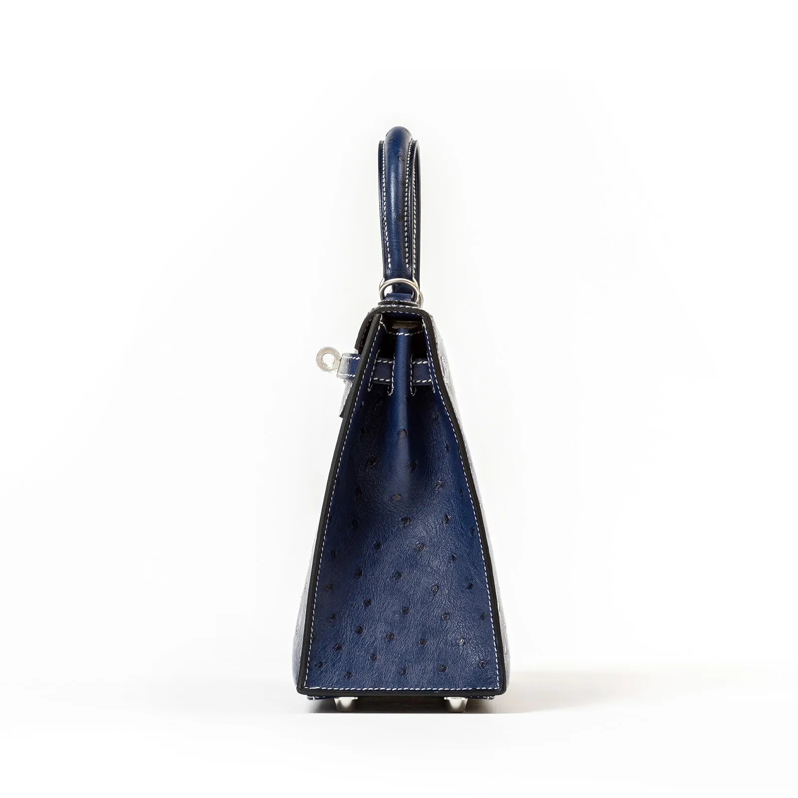 Side view of Hermès Horseshoe Kelly 25 Sellier Ostrich Blue Iris Gris with Brushed Palladium Hardware showing texture and handle