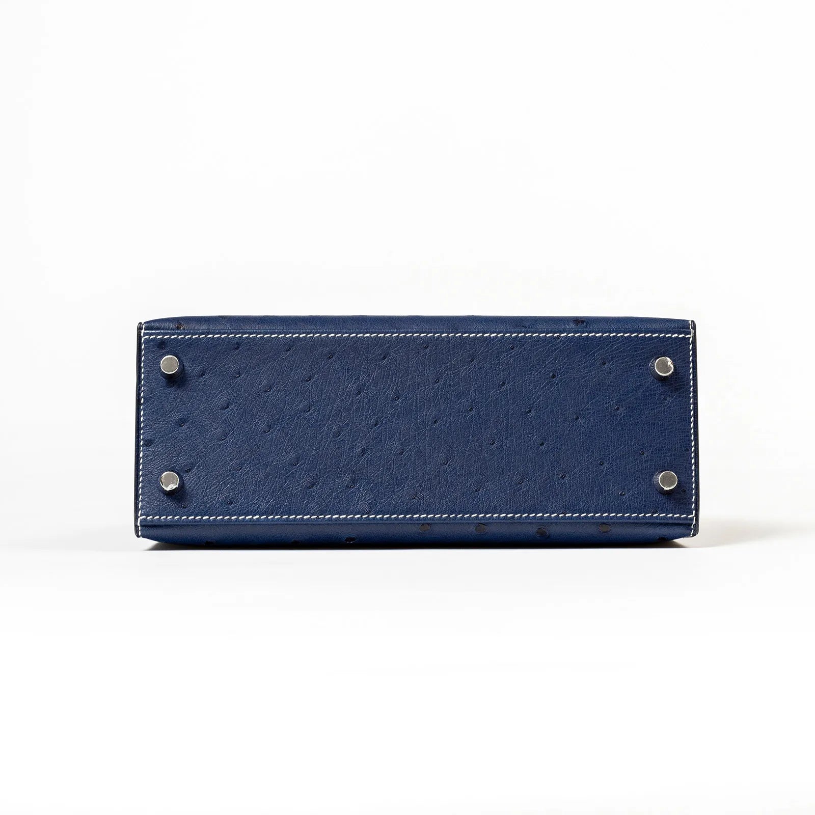 Bottom view of Hermès Horseshoe Kelly 25 Sellier Ostrich Blue Iris Gris Brushed Palladium Hardware bag showing feet and stitching detail