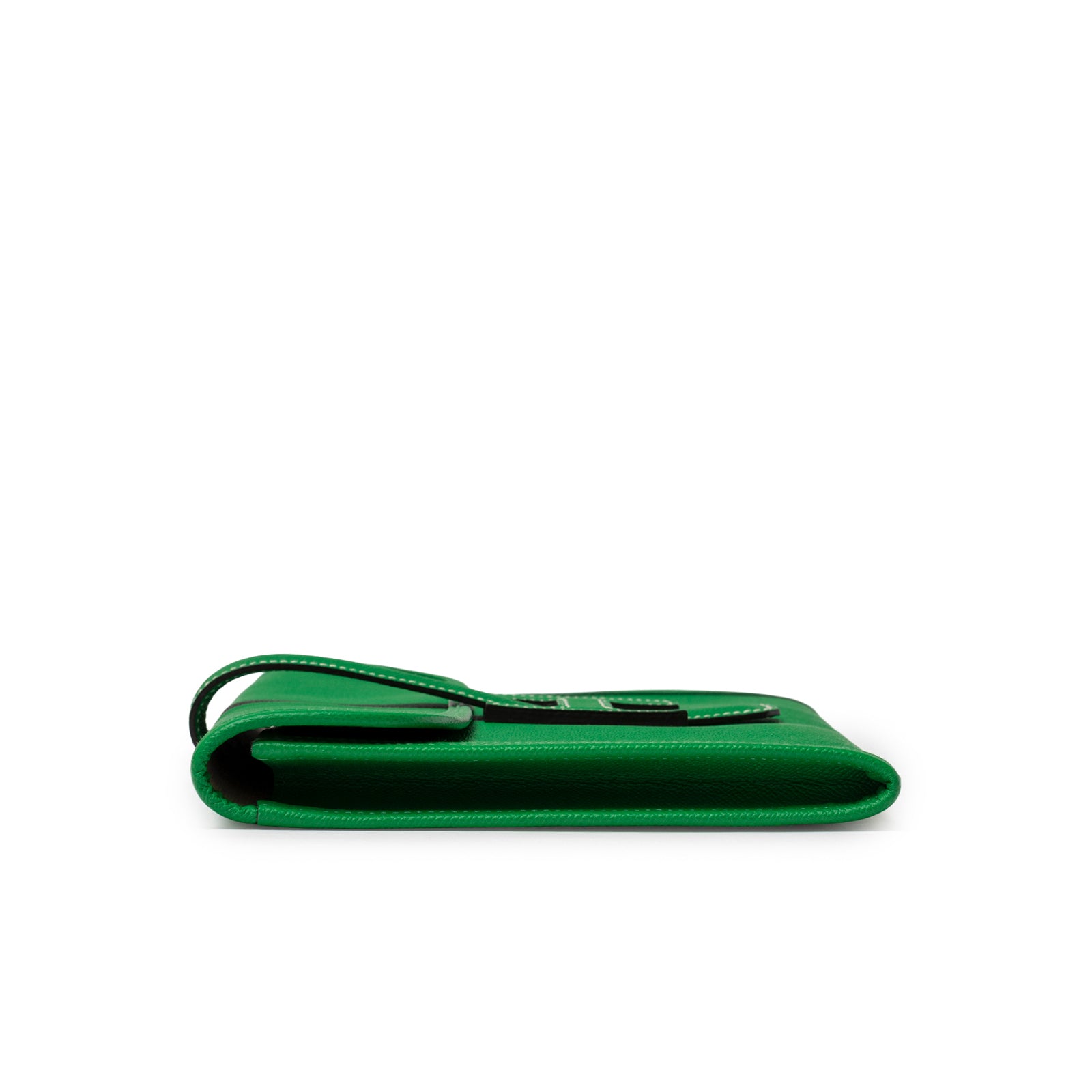 Side profile of Hermès Jige PM Bamboo Green Epsom showcasing slim silhouette and white stitching detail