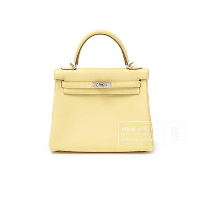 Front view of Hermès Kelly 25 Retourne Togo Jaune Poussin Palladium Hardware showing smooth leather and structured handle