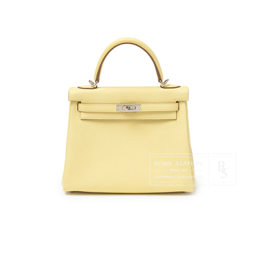 Front view of Hermès Kelly 25 Retourne Togo Jaune Poussin Palladium Hardware showing smooth leather and structured handle