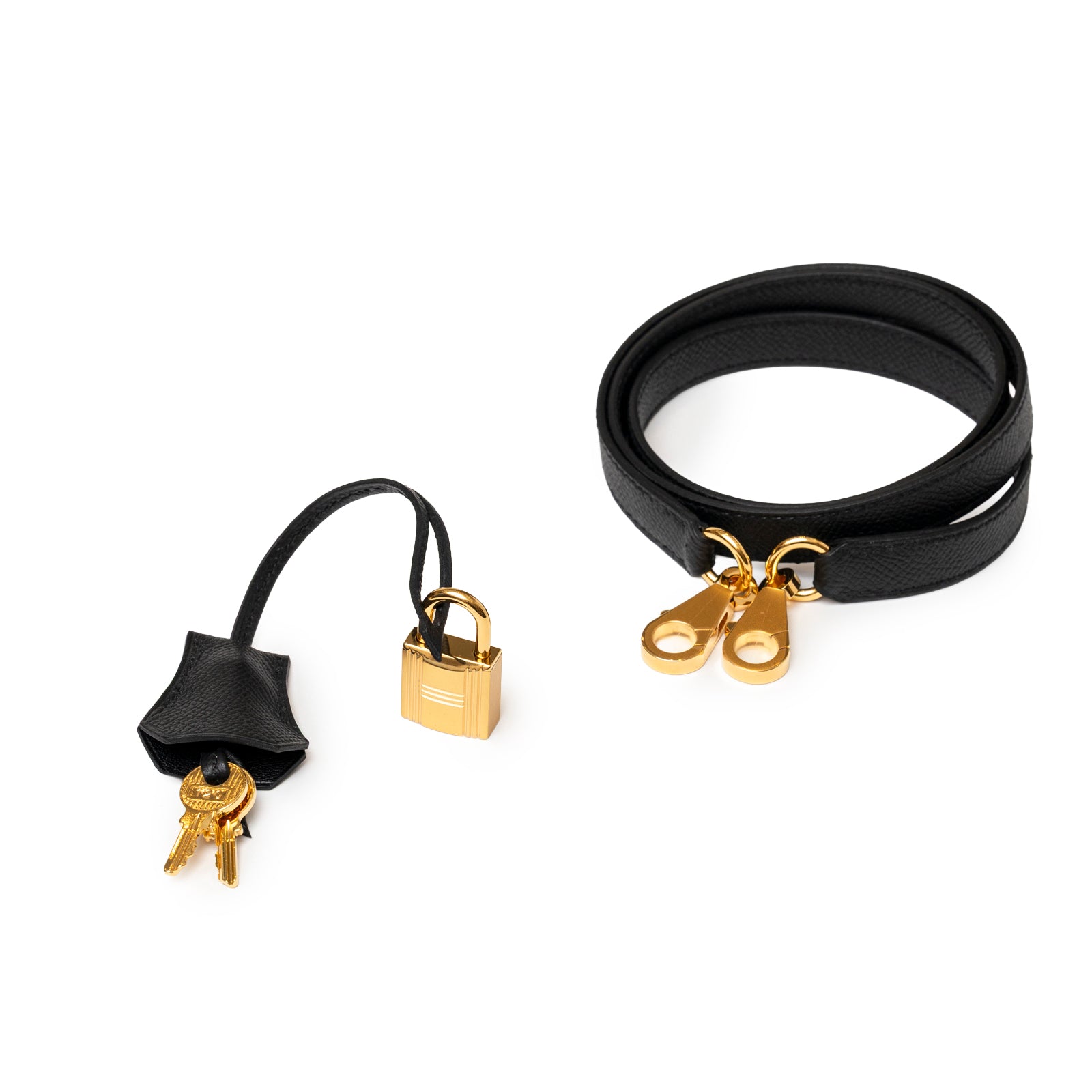 Hermès Kelly 25 Sellier Black Epsom Gold hardware showing black leather strap and gold lock with keys accessory