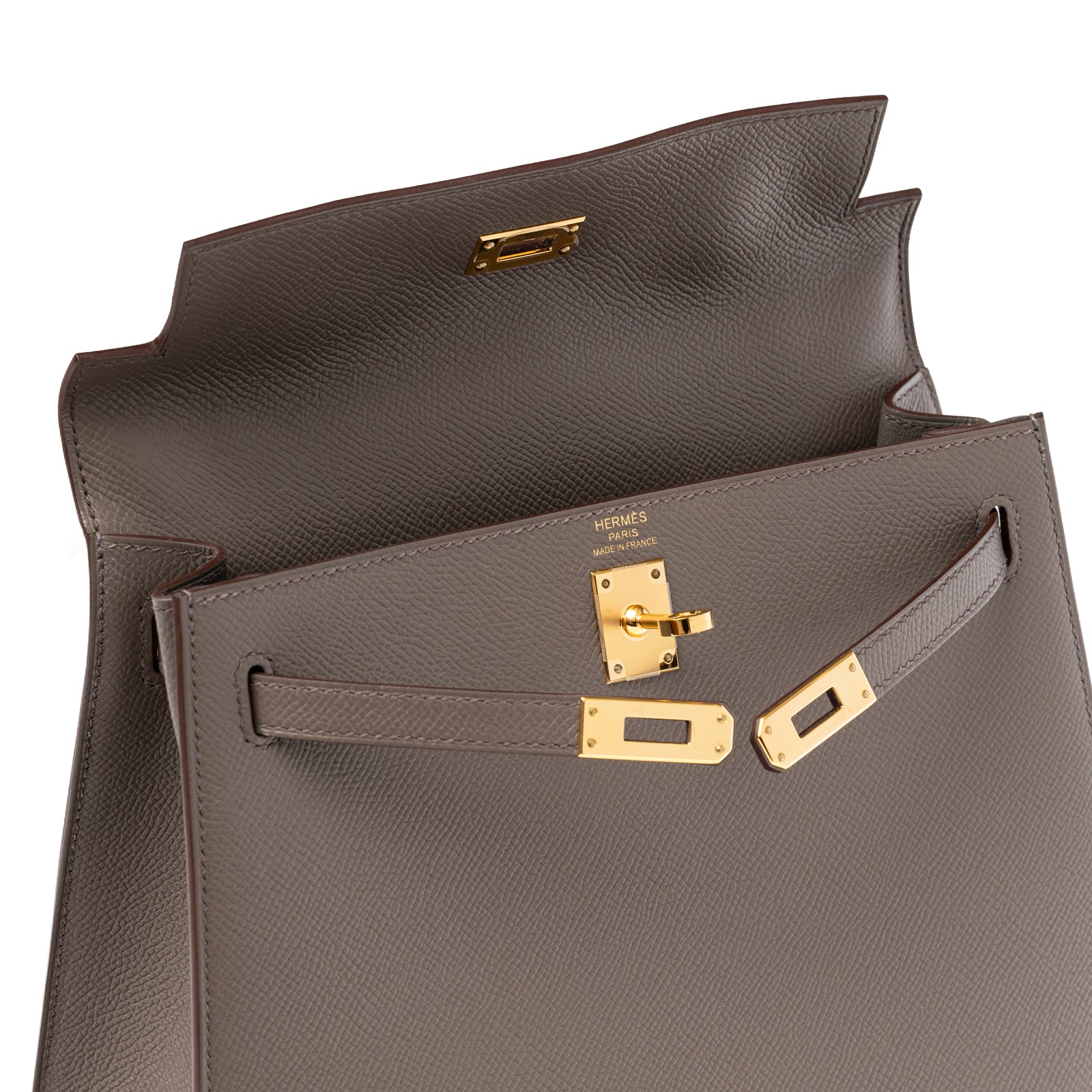 Close-up of Hermès Kelly 25 Sellier Etain Epsom Gold Hardware showing open flap and gold clasp detail