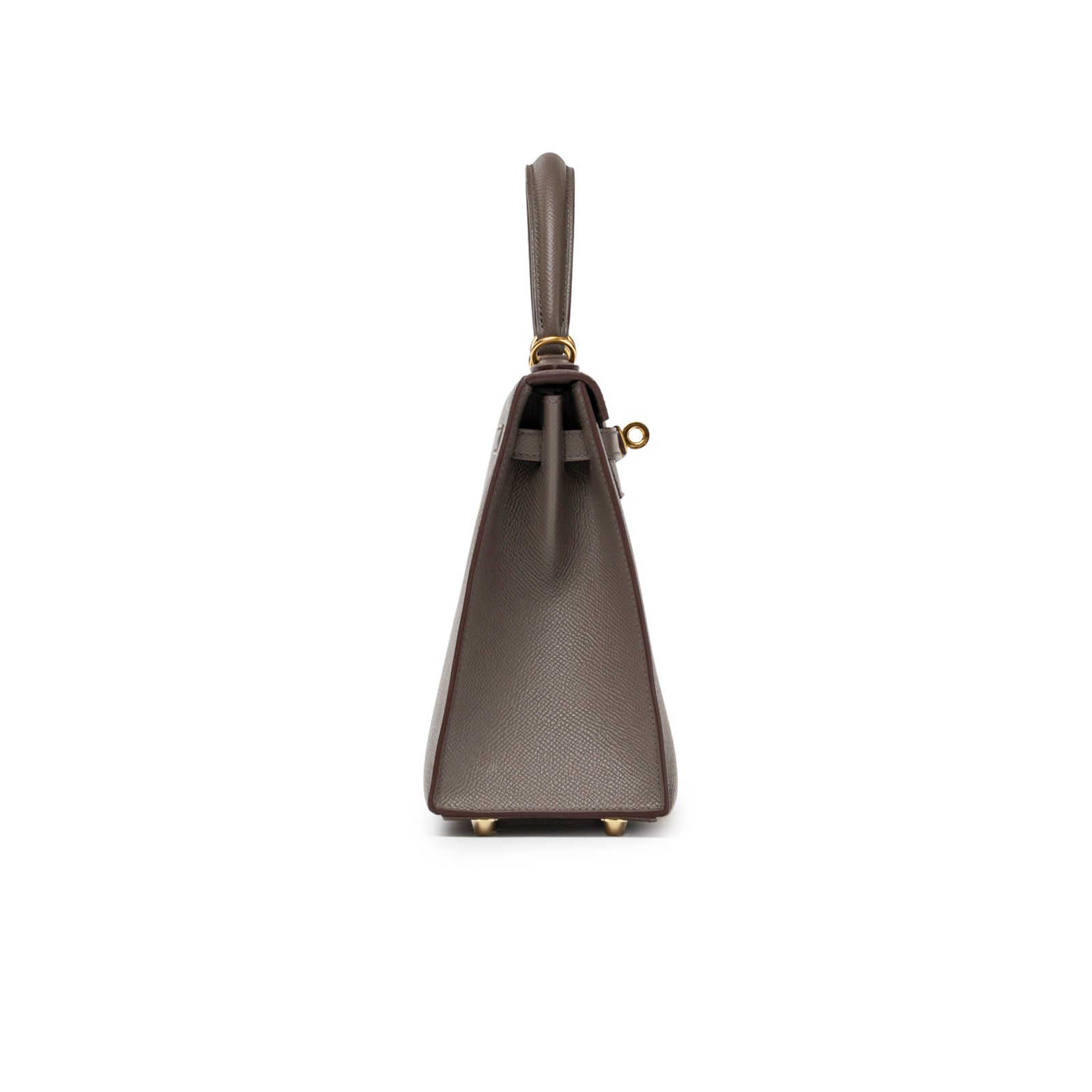 Side view of Hermès Kelly 25 Sellier Etain Epsom Gold Hardware showing structured leather and gold feet detail