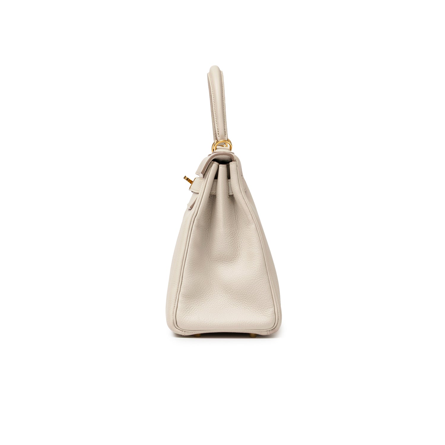 Side profile of Hermès Kelly 28 Retourne Beton Togo Gold Hardware showing textured light gray leather and handle detail
