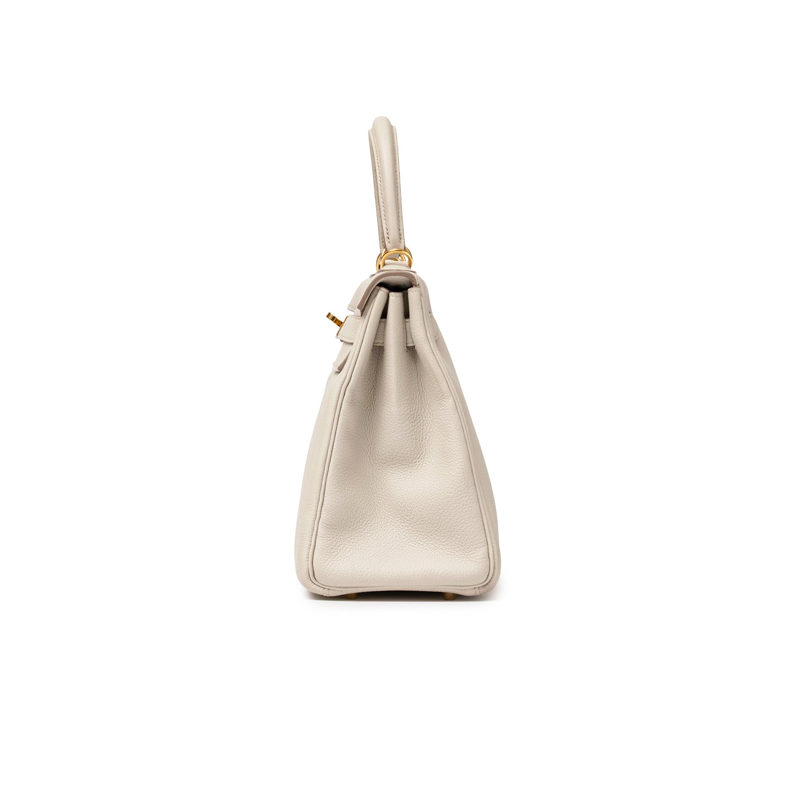 Side profile of Hermès Kelly 28 Retourne Beton Togo Gold Hardware showing textured light gray leather and handle detail