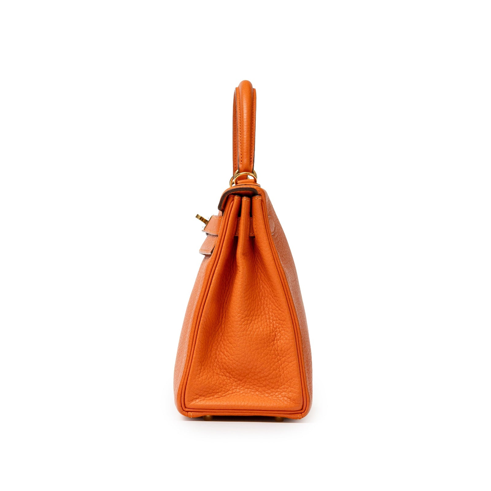 Side profile of Hermès Kelly 28 Retourne Orange Clemence Gold Hardware showcasing textured leather and structured silhouette