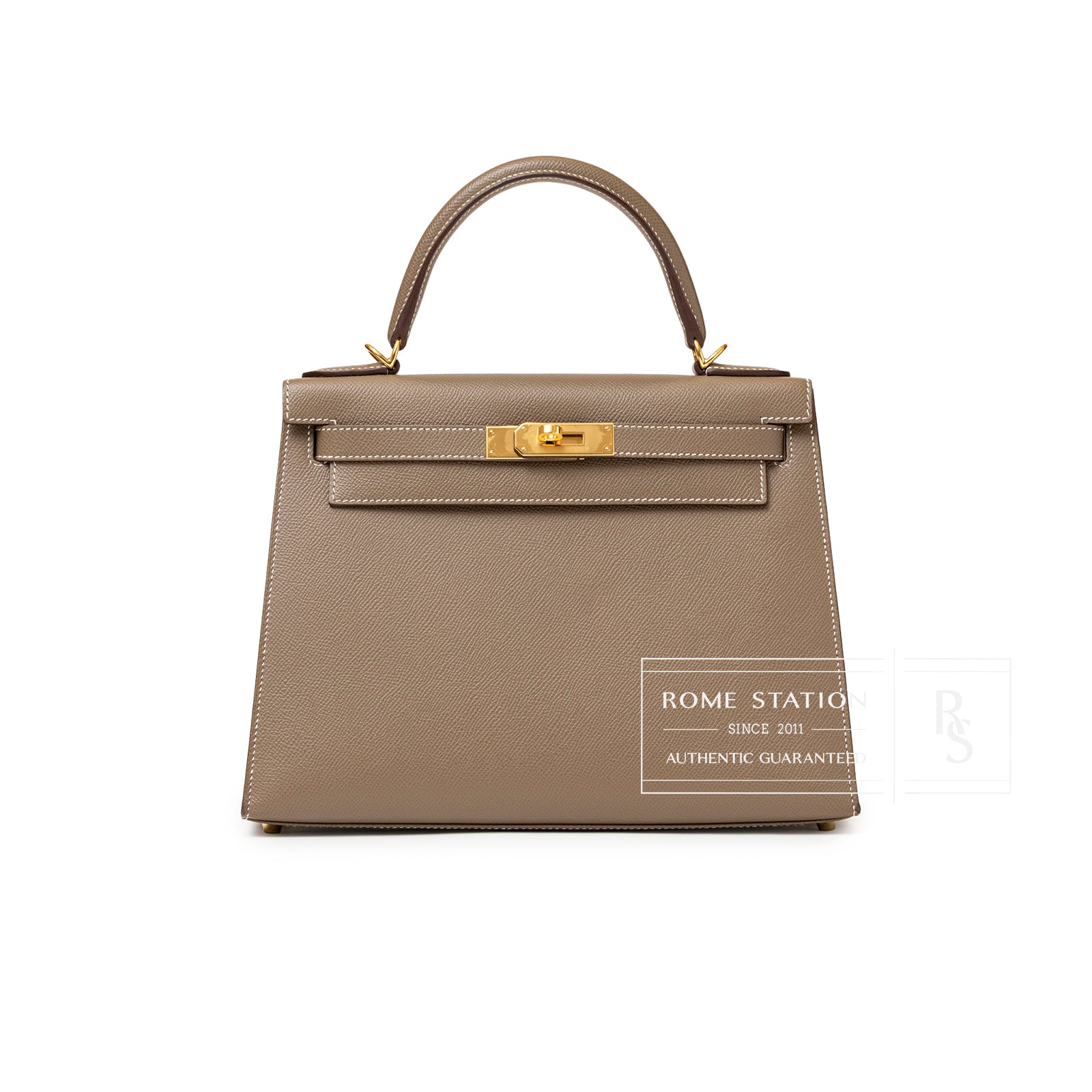 Front view of Hermès Kelly 28 Sellier Etoupe Epsom Gold hardware showing structured shape and gold clasp details.