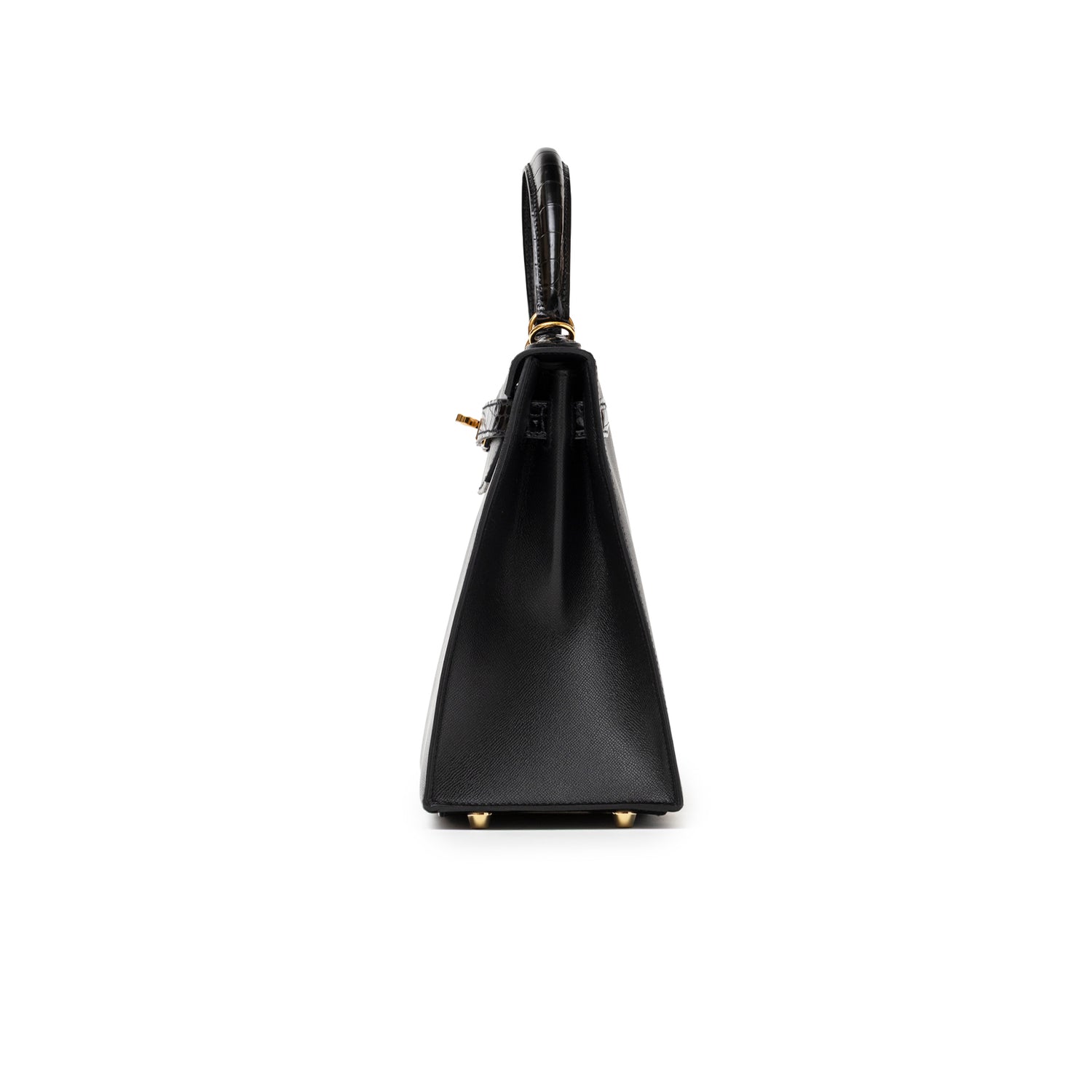 Side profile of Hermès Kelly 28 Sellier Touch Black Madame Shiny Niloticus Crocodile Gold Hardware showing structured silhouette and handle