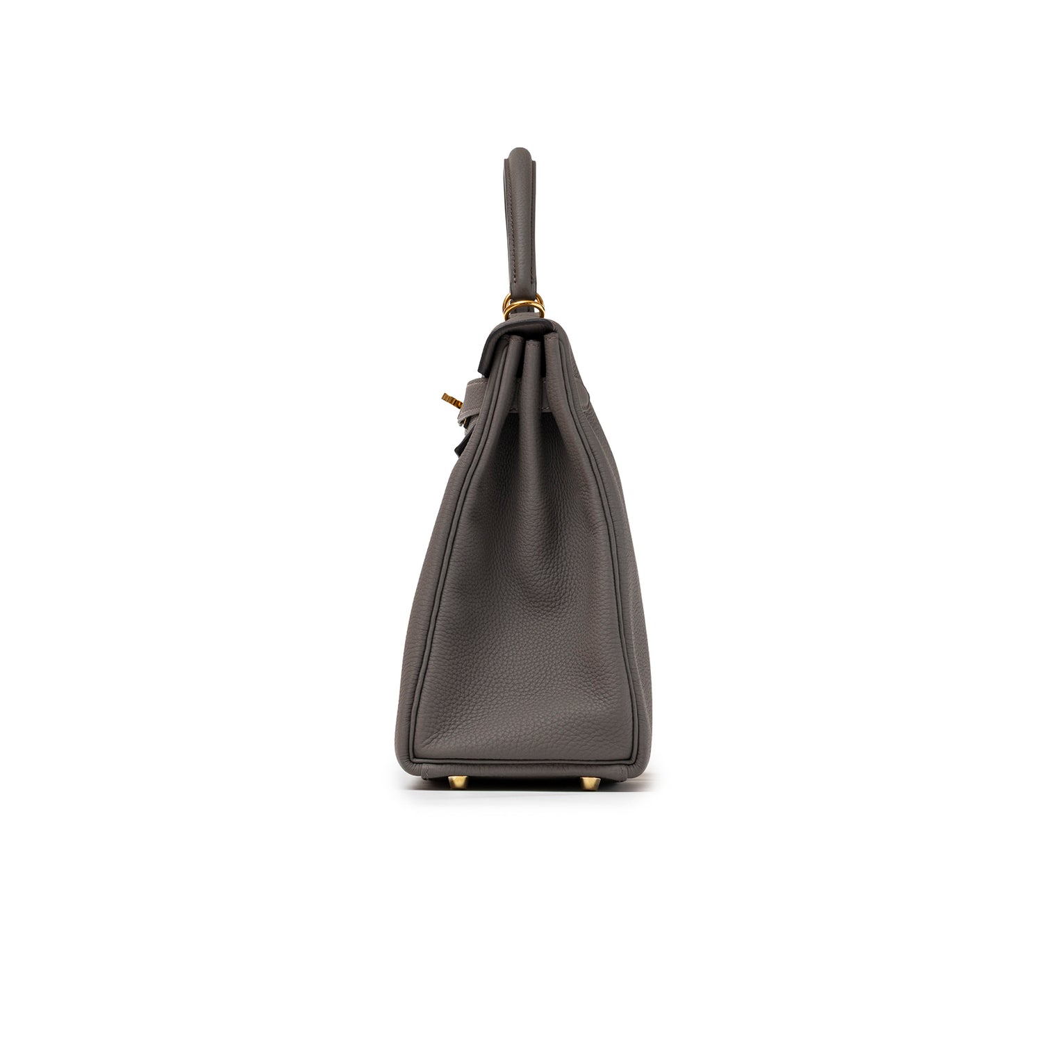 Side profile of Hermès Kelly 32 Retourne Etain Togo Gold Hardware highlighting its structured silhouette and leather texture.