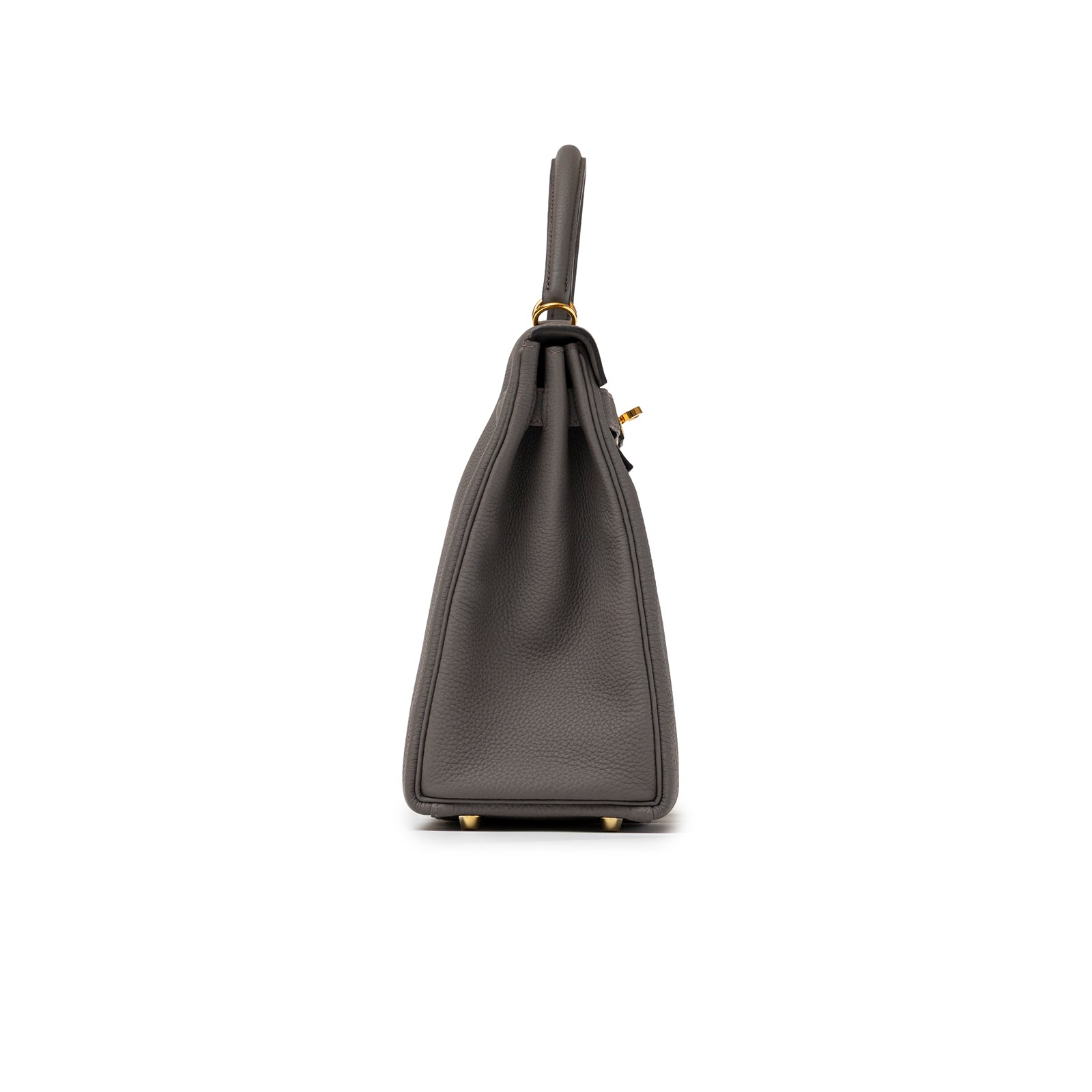 Side view of Hermès Kelly 32 Retourne Etain Togo Gold Hardware showcasing textured leather and structured silhouette.