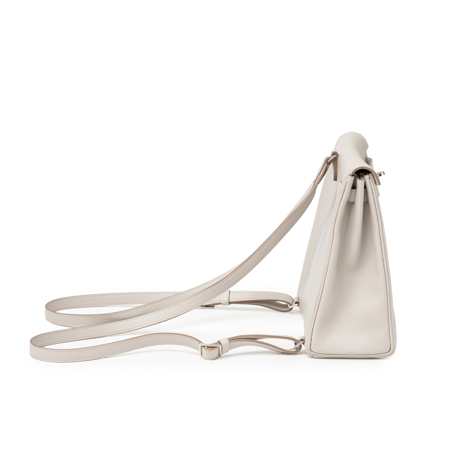 Side profile of Hermès Kelly Ado Backpack Gris Perle Evercolor Palladium Hardware with smooth leather sides and adjustable straps