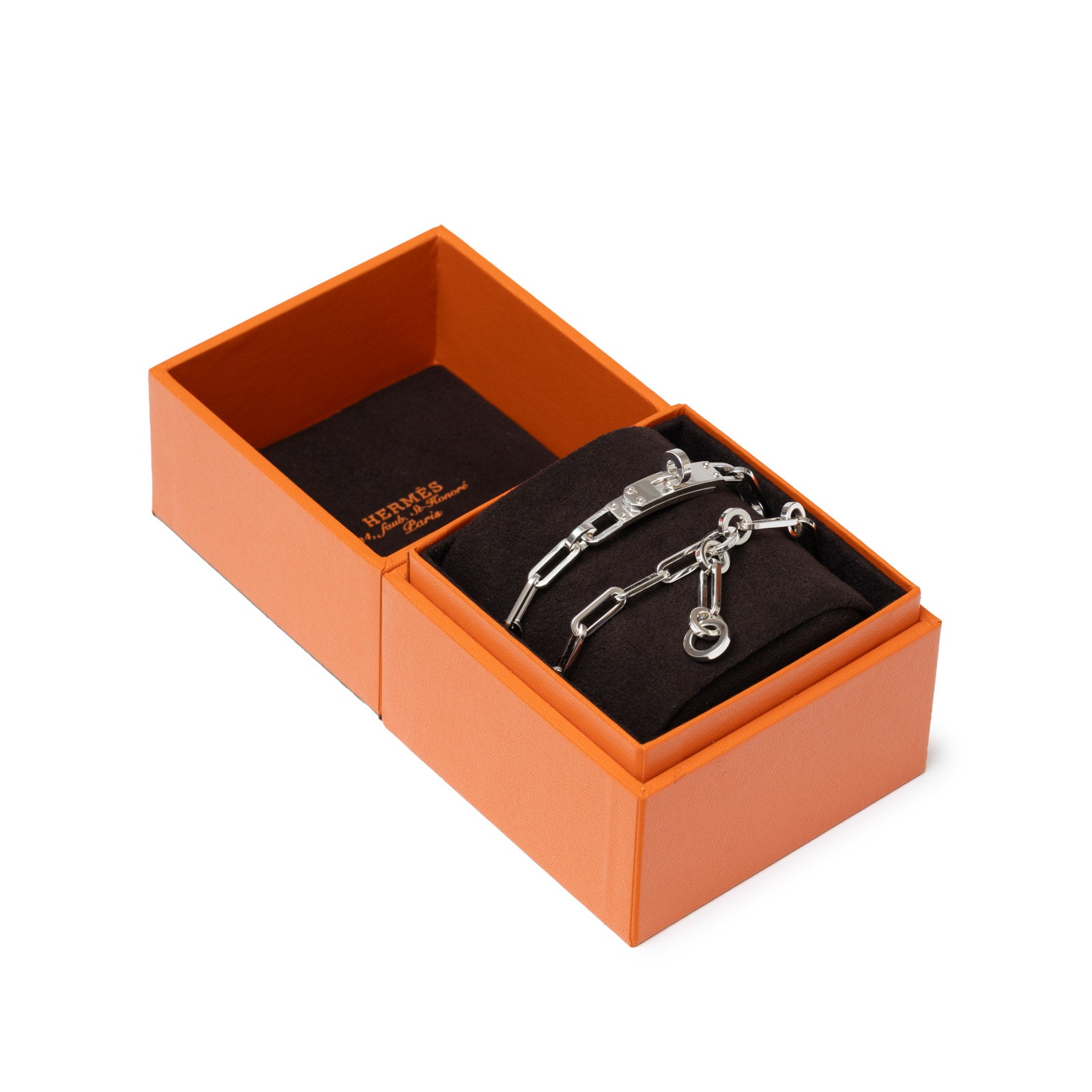 Angled shot of Hermès Kelly Chain Choker/Bracelet with Touret Clasp Sliver Ag925 in orange box with black cushion
