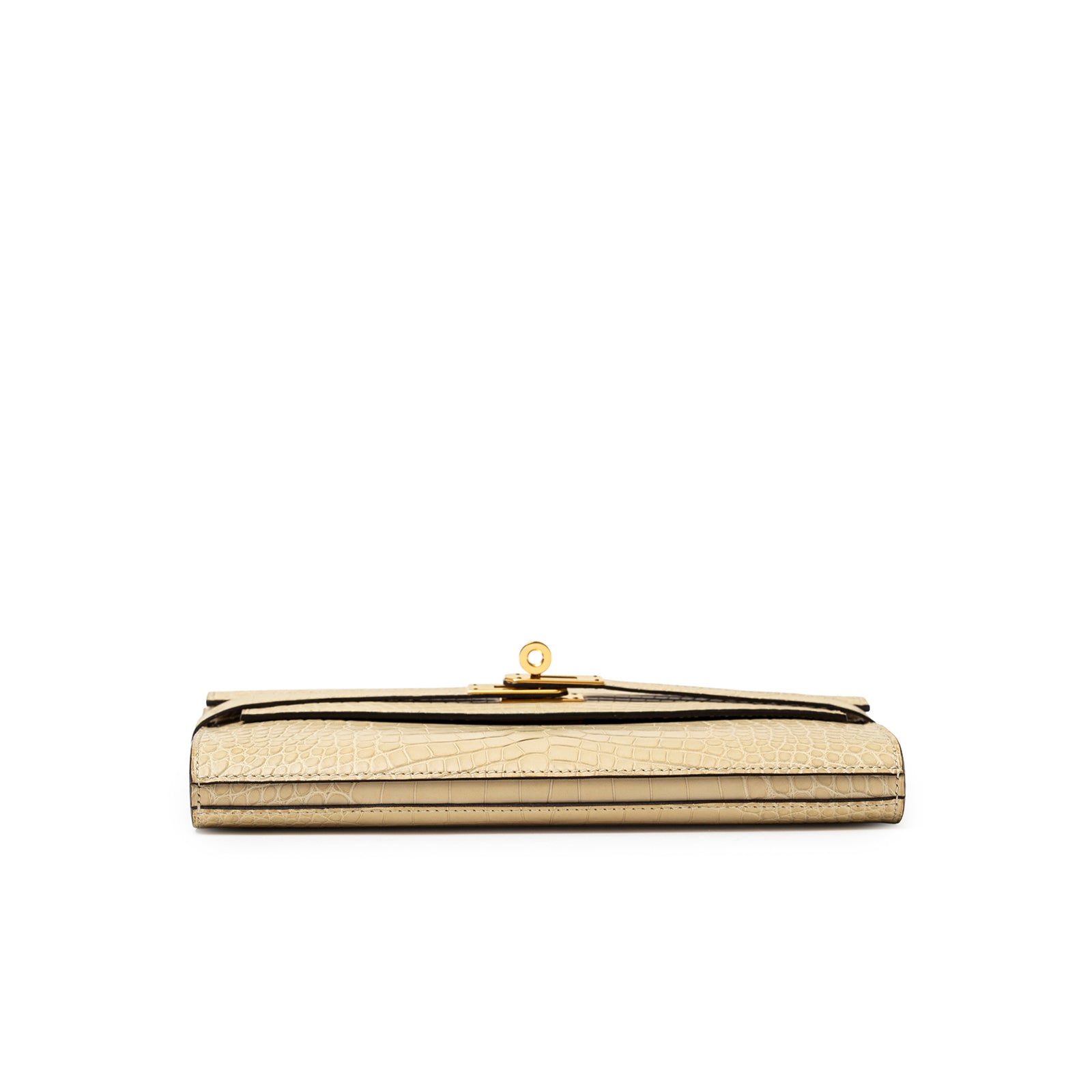 Bottom close-up of Hermès Kelly Long Wallet Vanille Matte Alligator Gold Hardware highlighting textured leather and gold clasp detail