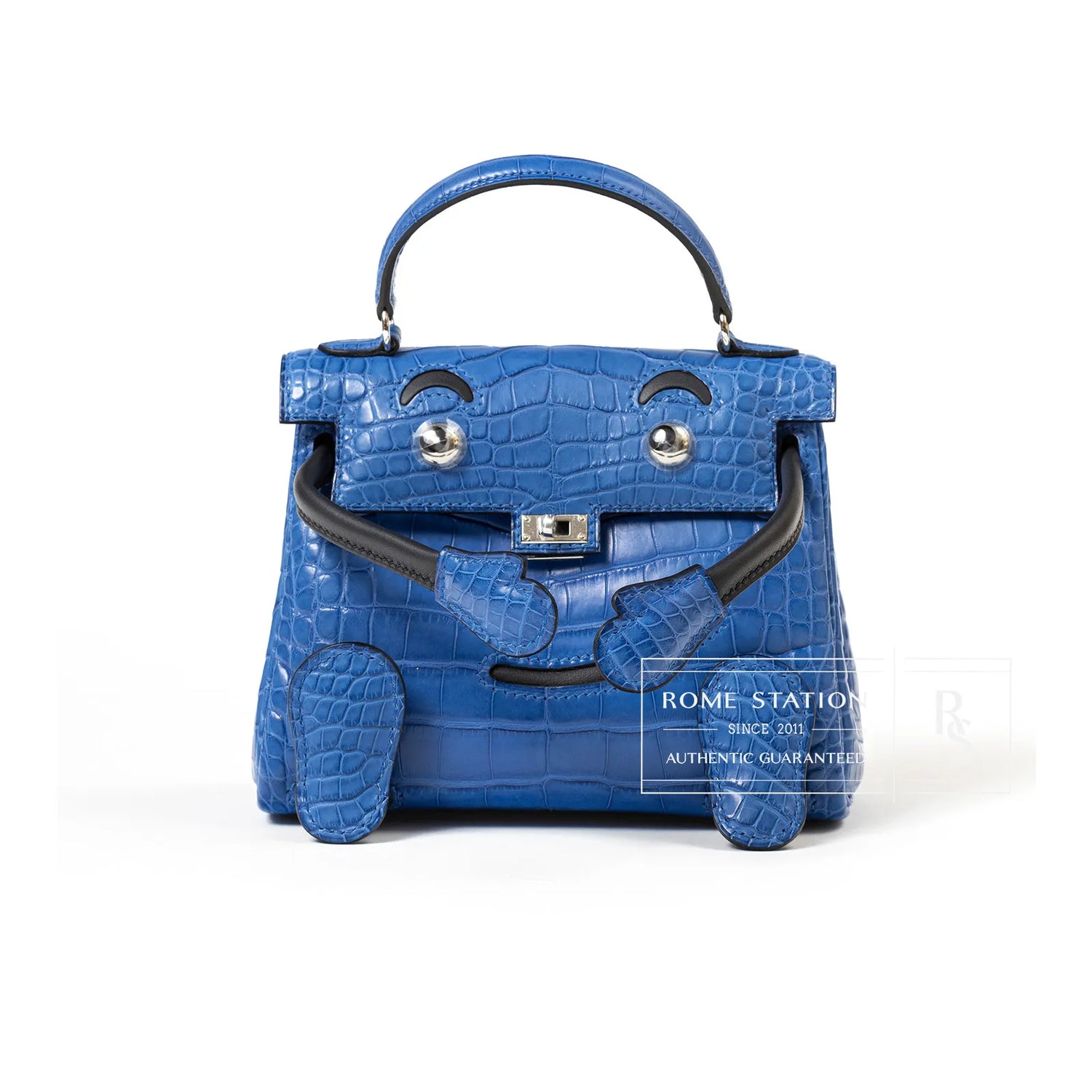 Front view of Hermès Kelly Quelle Idole Doll Bag AB Bleu Zellige/Bleu Indigo Palladium Hardware with playful design details