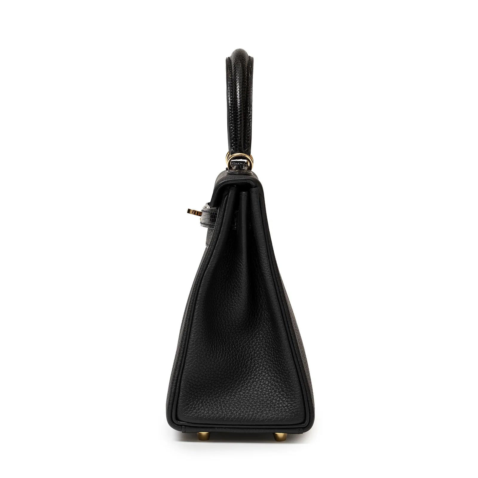 Side view of Hermès Kelly 25 Retourne Black Touch Togo/Lizard Permabrass Hardware handbag with gold hardware, showing its structured silhouette.