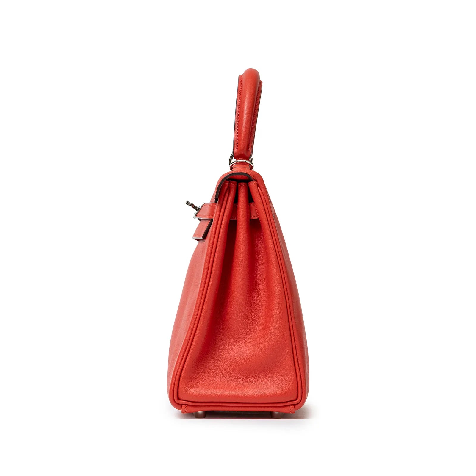 Side view of Hermès Kelly 25 Retourne Rouge Swift Palladium Hardware showing smooth leather and structured silhouette