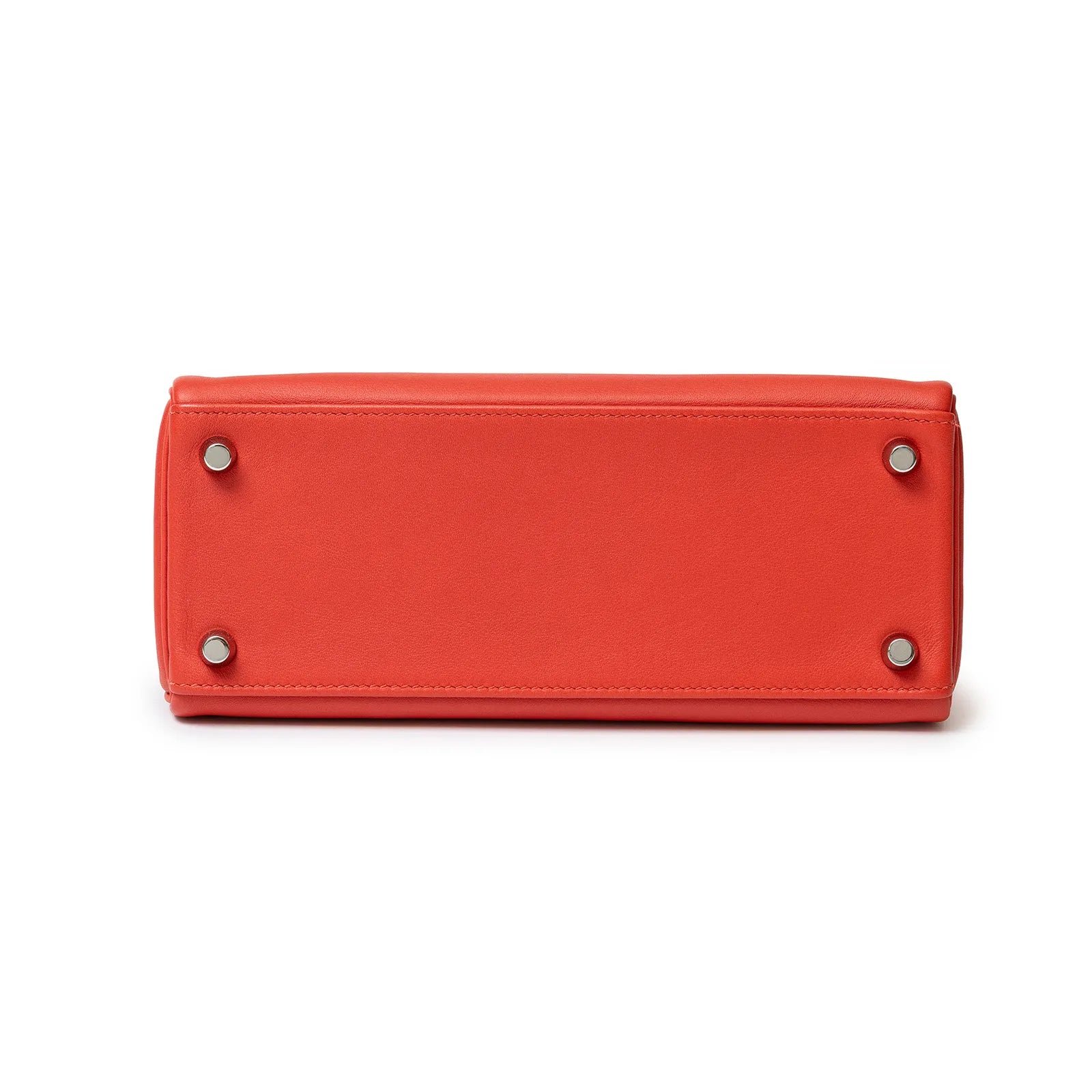 Bottom view of Hermès Kelly 25 Retourne Rouge Swift Palladium Hardware showing protective feet and leather base