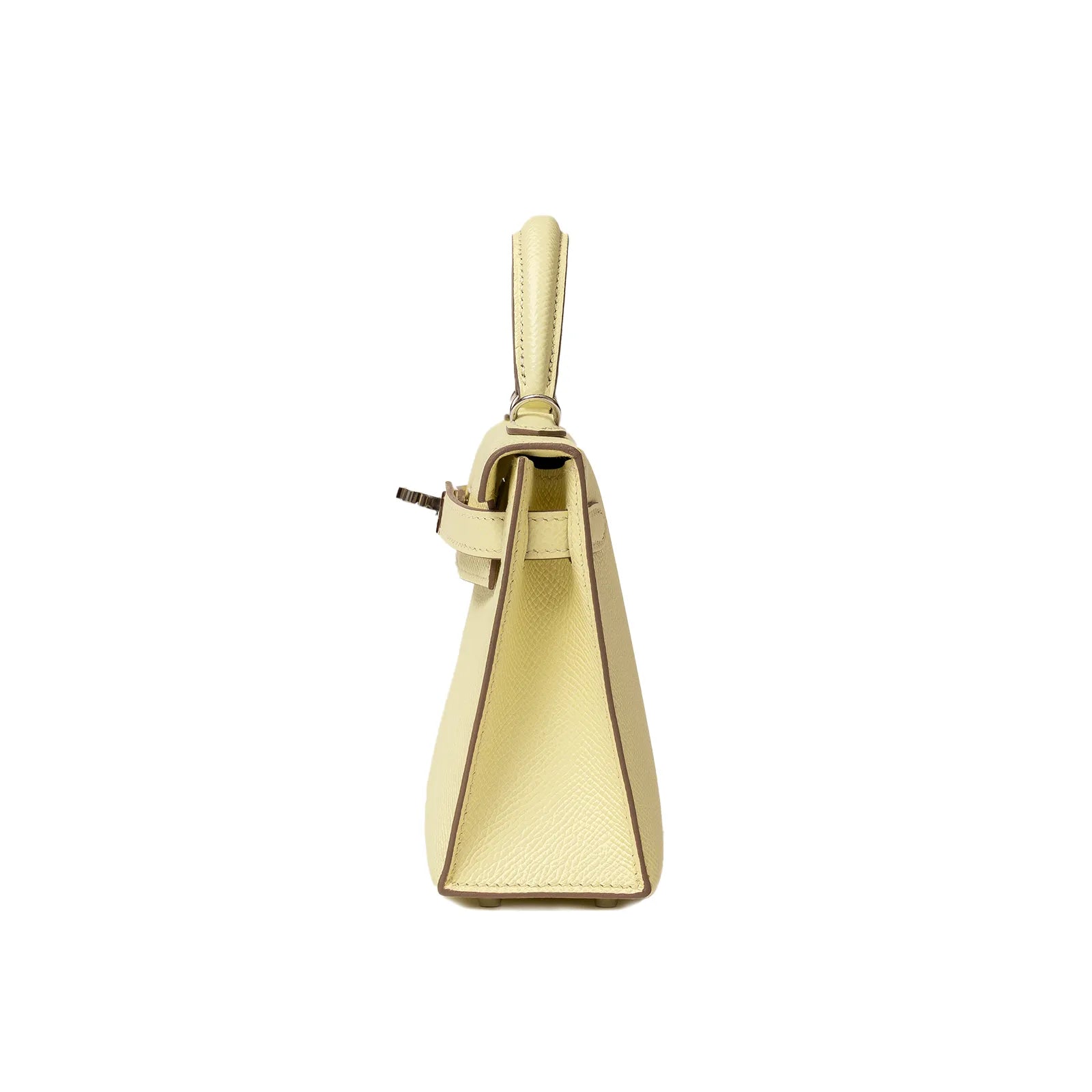 Side profile of Hermès Mini Kelly II Sellier 20 Jaune Milton Epsom Palladium Hardware handbag showing structured silhouette