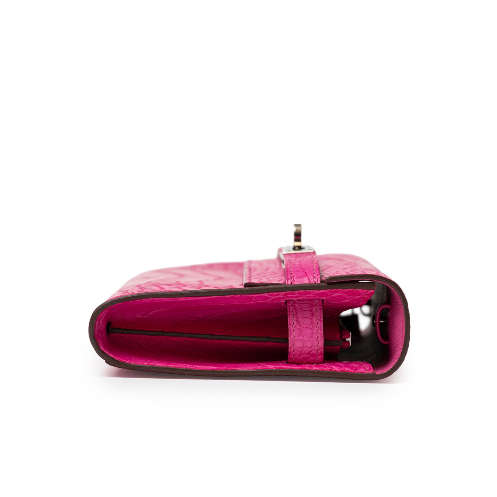 Side view of Hermès Kelly Wallet To Go Rose Shocking Matte Alligator Palladium Hardware showing slim profile and strap detail