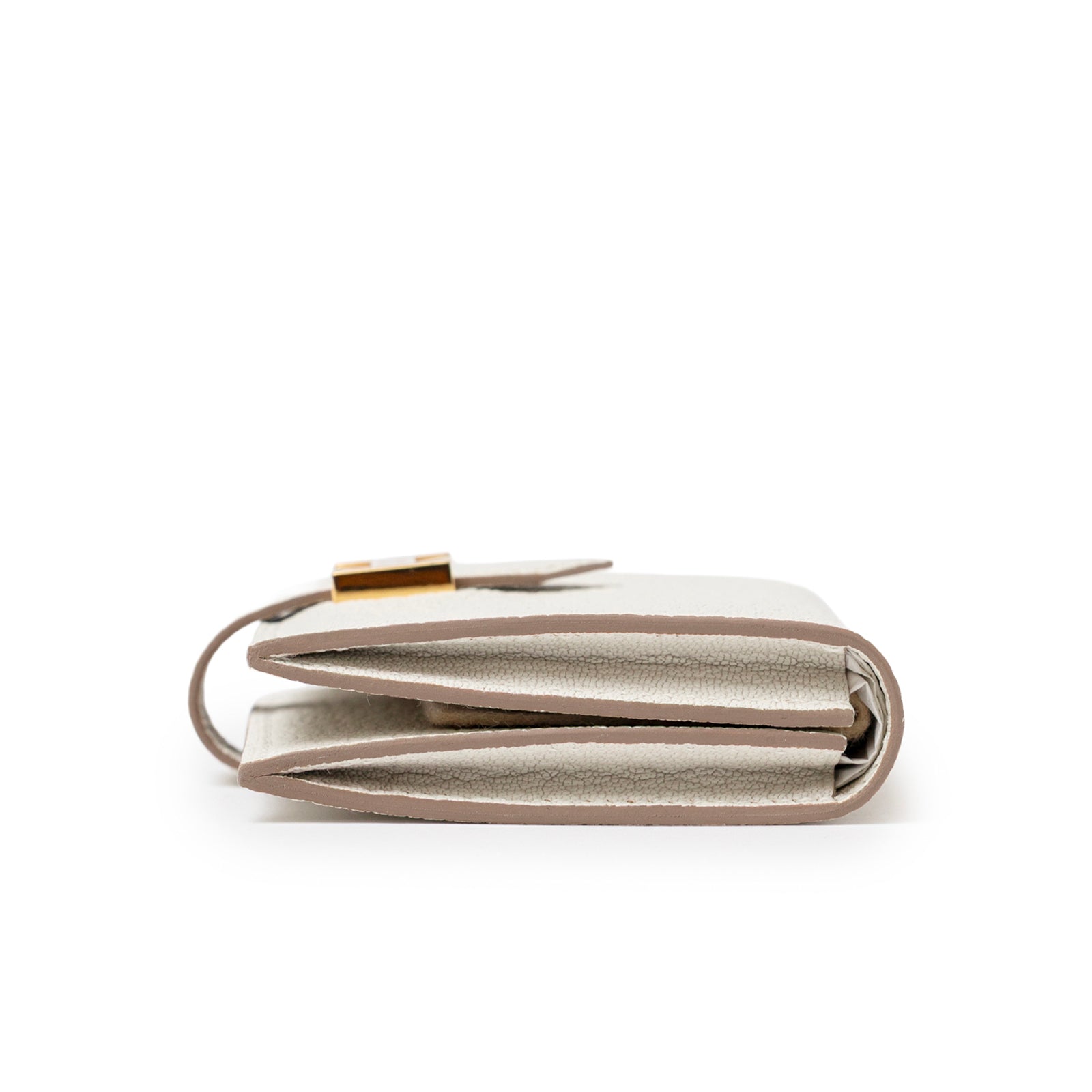 Side view of Hermès Mini Bearn Wallet Beton Chevre Mysore Gold Hardware showing slim profile and stitching detail