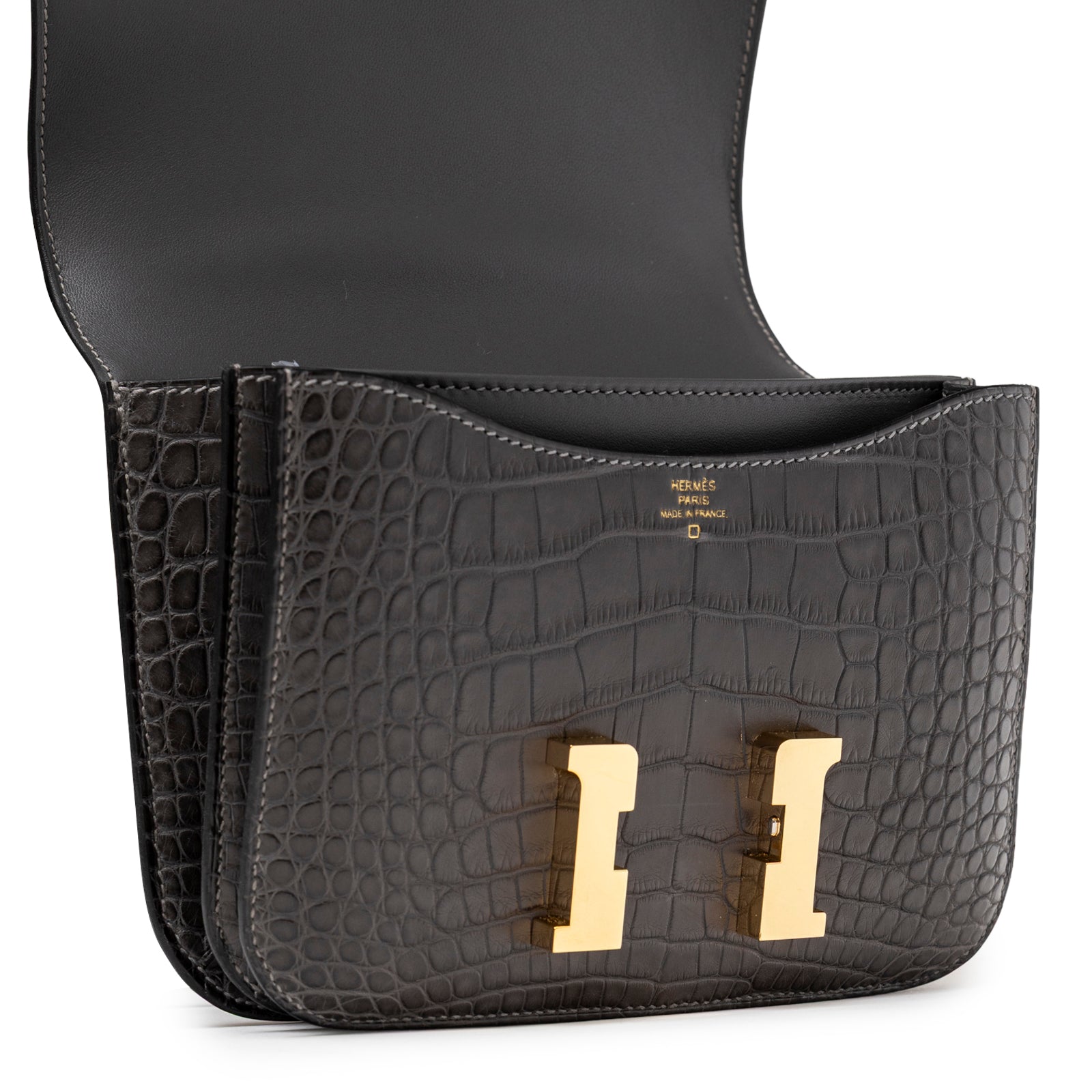 Open view of Hermès Mini Constance 18 Graphite Matte Alligator Gold Hardware showing interior and gold clasp detail